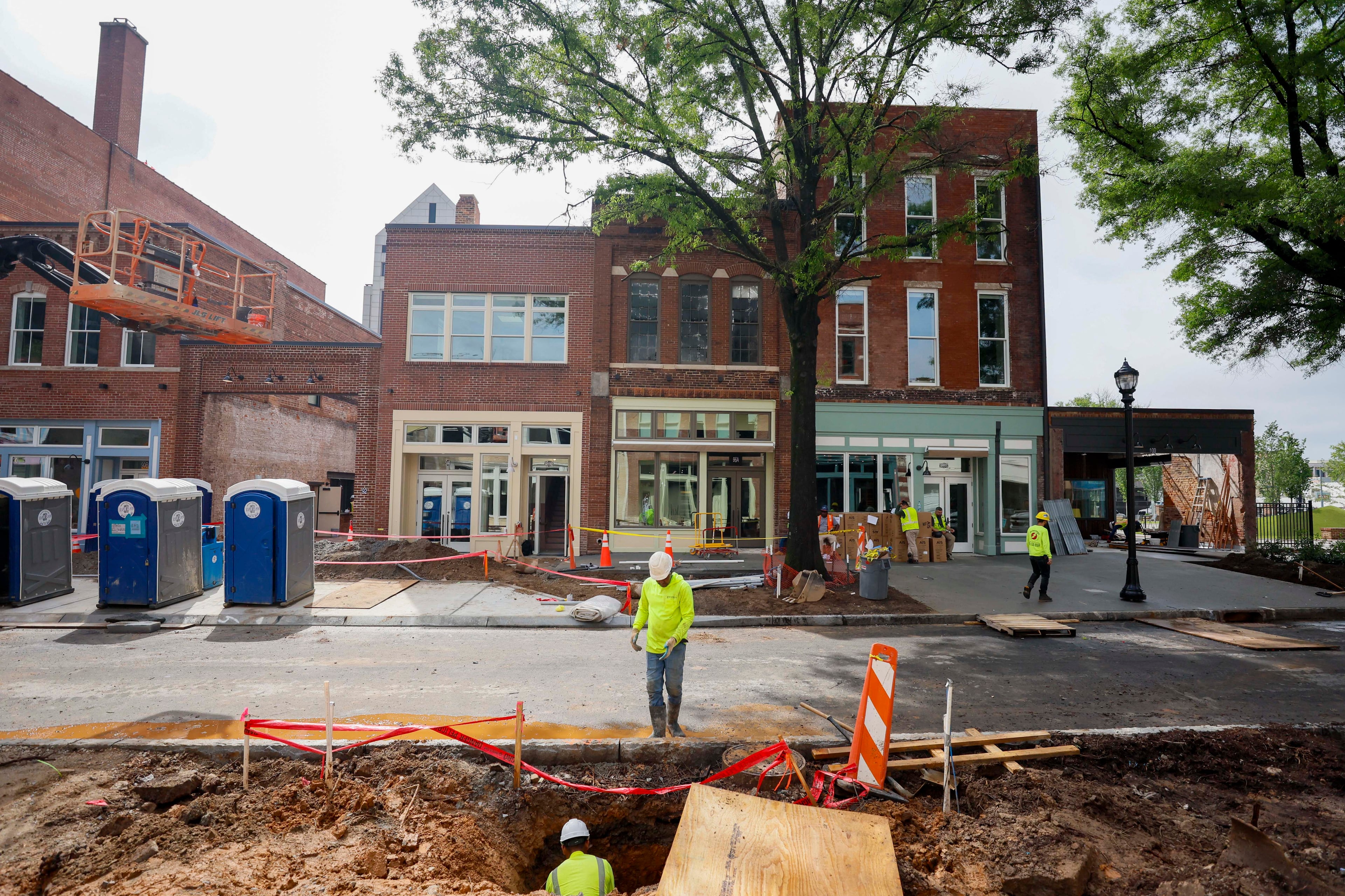 Construction workers are actively working on Broad Street as South Downtown undergoes revitalization. This area features the city’s largest collection of historic real estate assets and is located in the heart of the city, as seen on Wednesday, May 27, 2026. The South Downtown portfolio is owned by David Cummings and Jon Birdsong, founders of Atlanta Ventures, who also run Atlanta Tech Village in Buckhead. (Miguel Martinez/AJC)