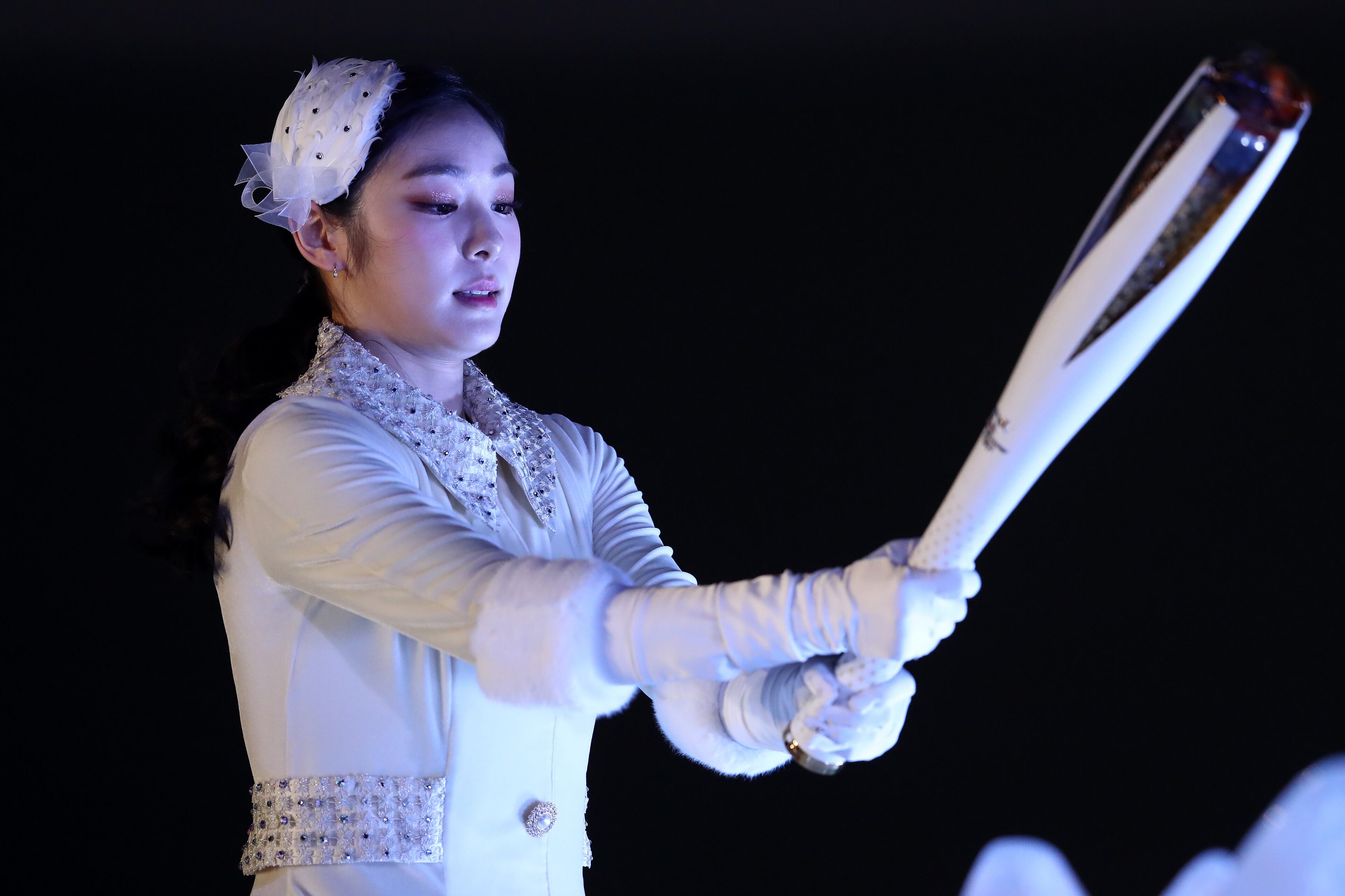 PYEONGCHANG-GUN, SOUTH KOREA - FEBRUARY 09: Kim Yu-na, South Korean Figure Skater lights the cauldron during the Opening Ceremony of the PyeongChang 2018 Winter Olympic Games at PyeongChang Olympic Stadium on February 9, 2018 in Pyeongchang-gun, South Korea. (Photo by Dean Mouhtaropoulos/Getty Images)
