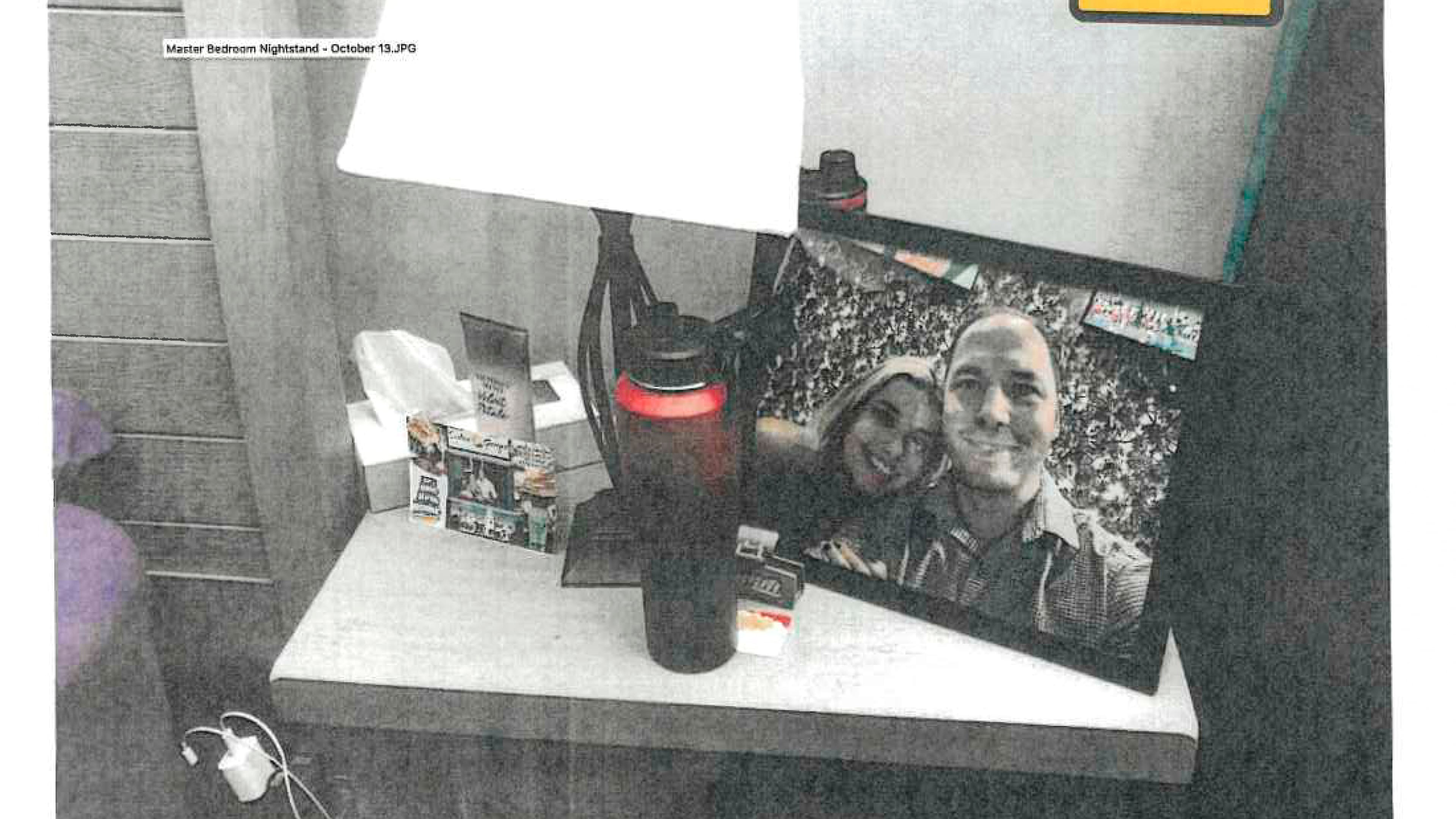 FILE - This image provided by the Fairfax County Police Department and taken on Oct. 13, 2023, was submitted as evidence in the murder case against Brendan Banfield shows a framed photo of Banfield and Juliana Peres Magalhães on his bedside table in Herndon, Va. (Fairfax County Police Department via AP, File)