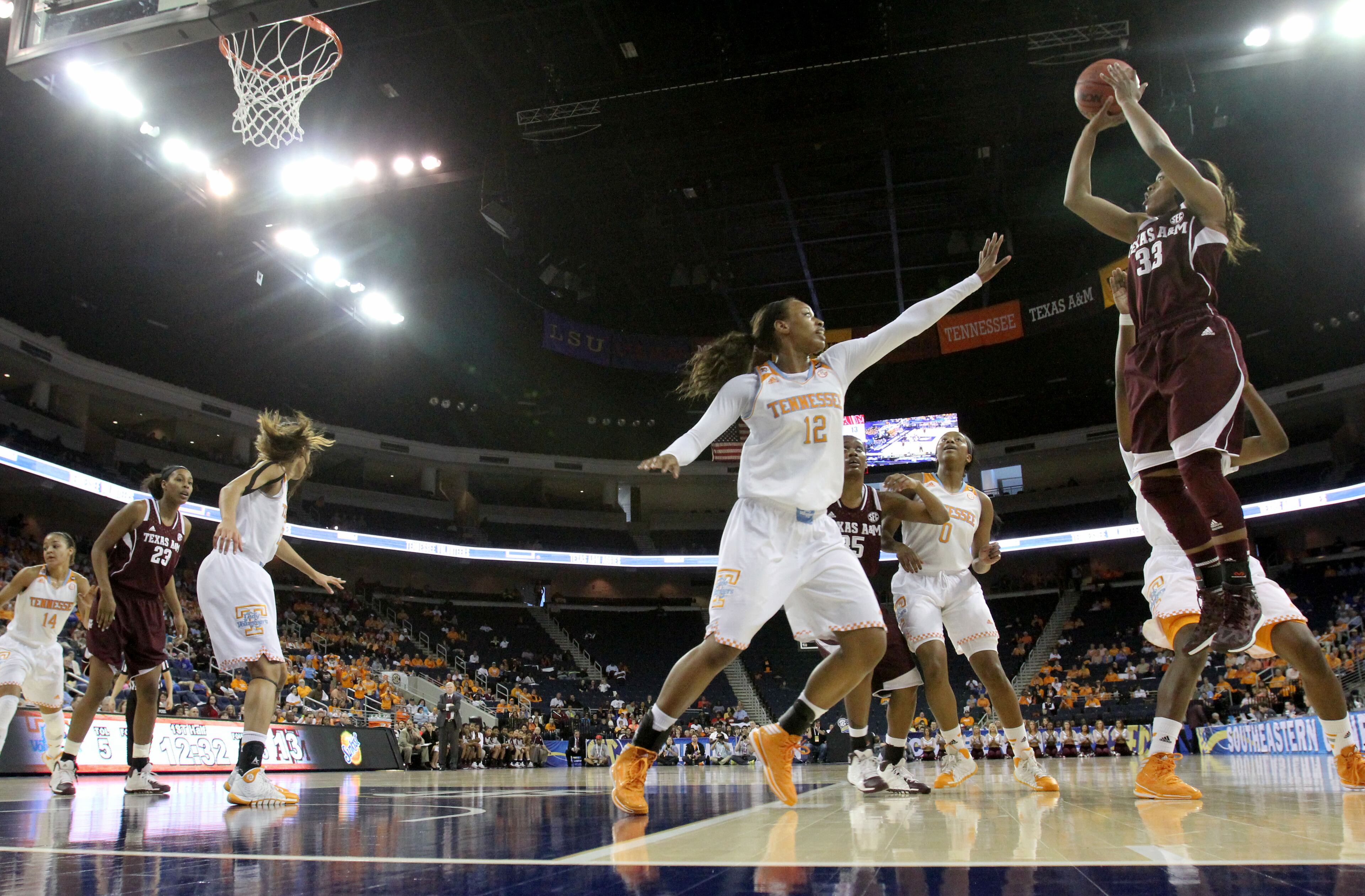 Texas A&M guard Courtney Walker (33) attempts a shot over Tennessee forward Bashaara Graves (12) during Tennessee's win over Texas A&M. (AP Photo/Jason Getz)