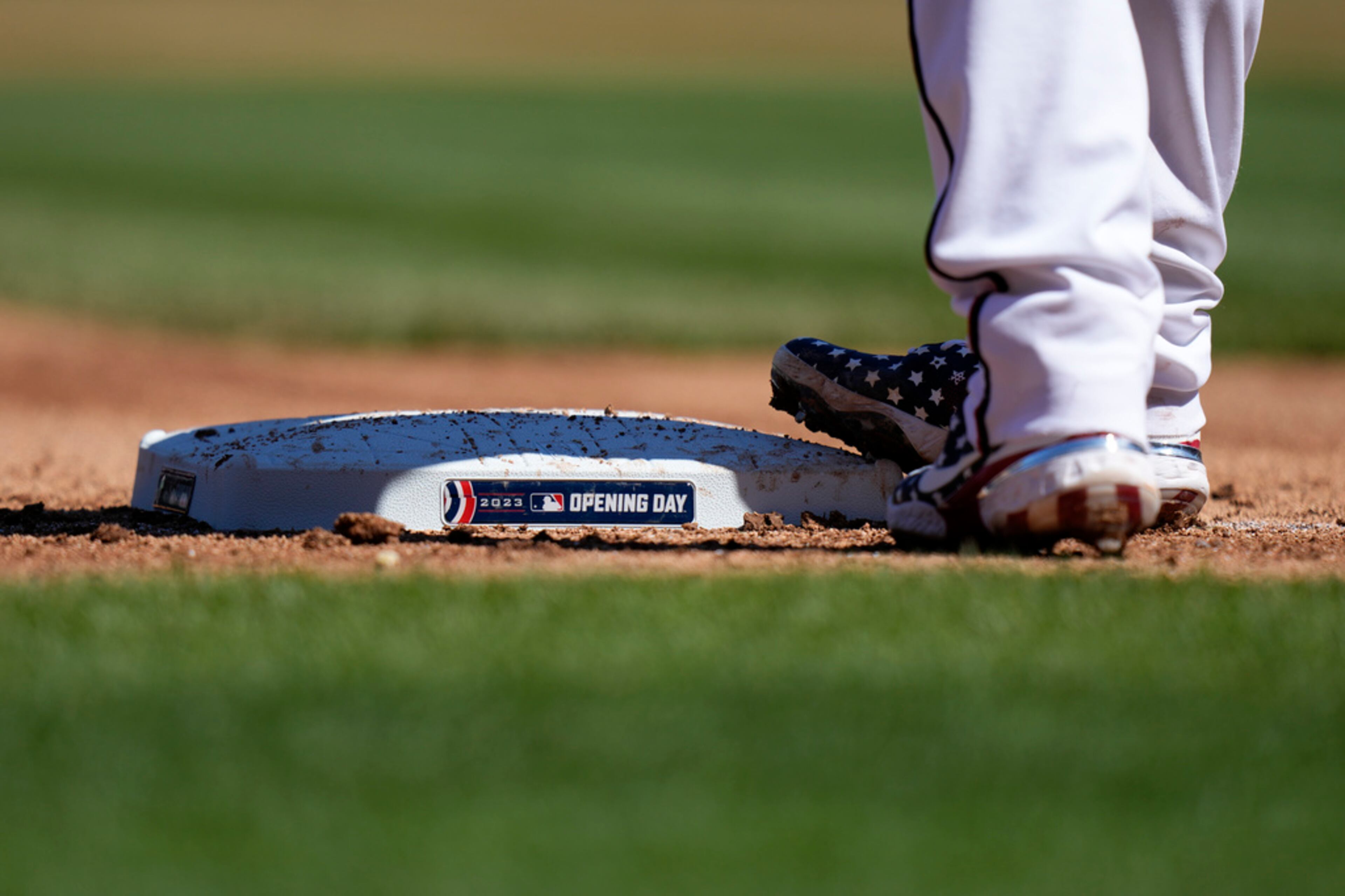 An Opening Day sticker is affixed to a base during an opening day baseball game between the Atlanta Braves and the Washington Nationals at Nationals Park, Thursday, March 30, 2023, in Washington. (AP Photo/Alex Brandon)