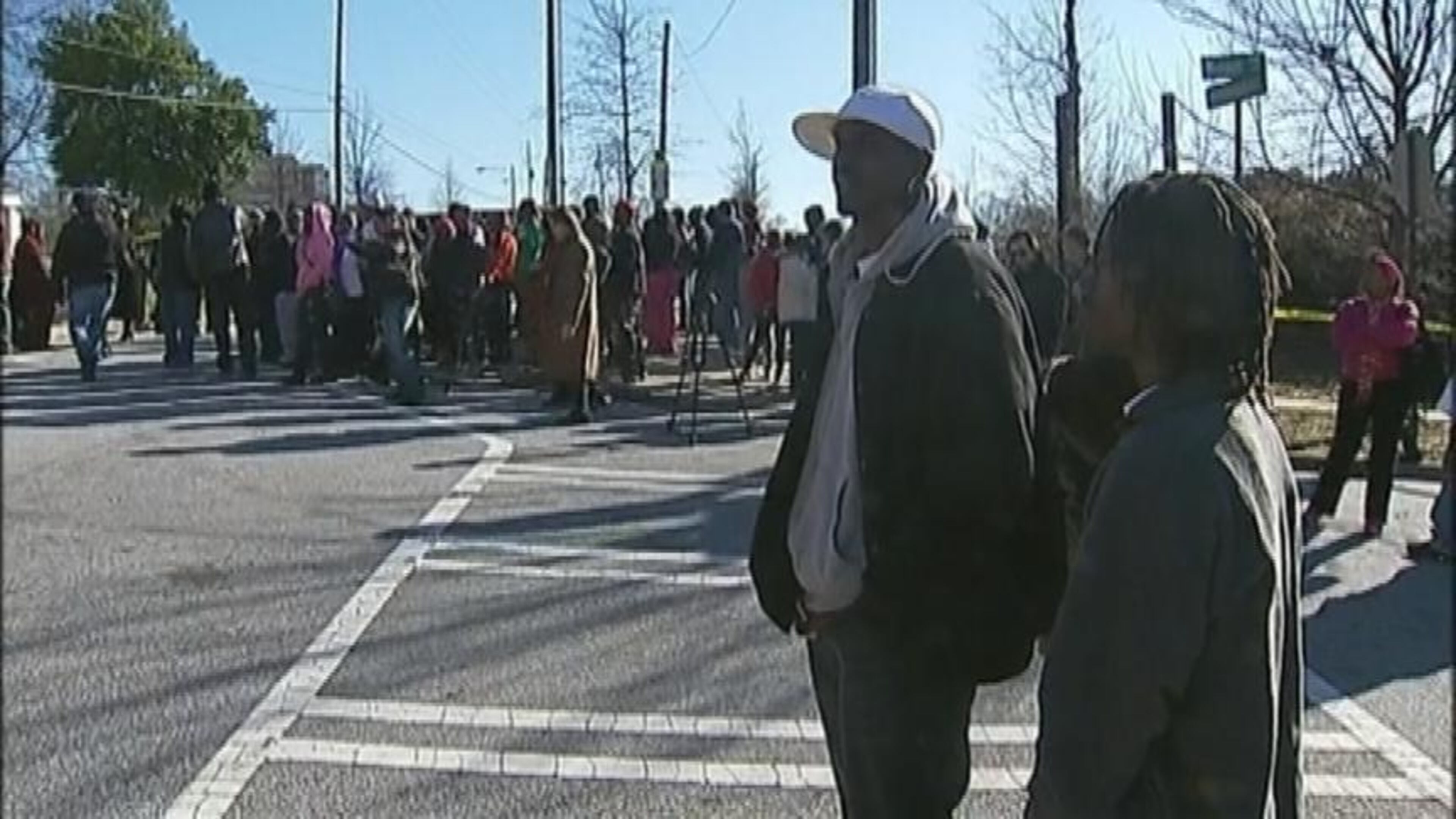Anxious family members wait for information outside Price Middle School following a shooting Thursday.
