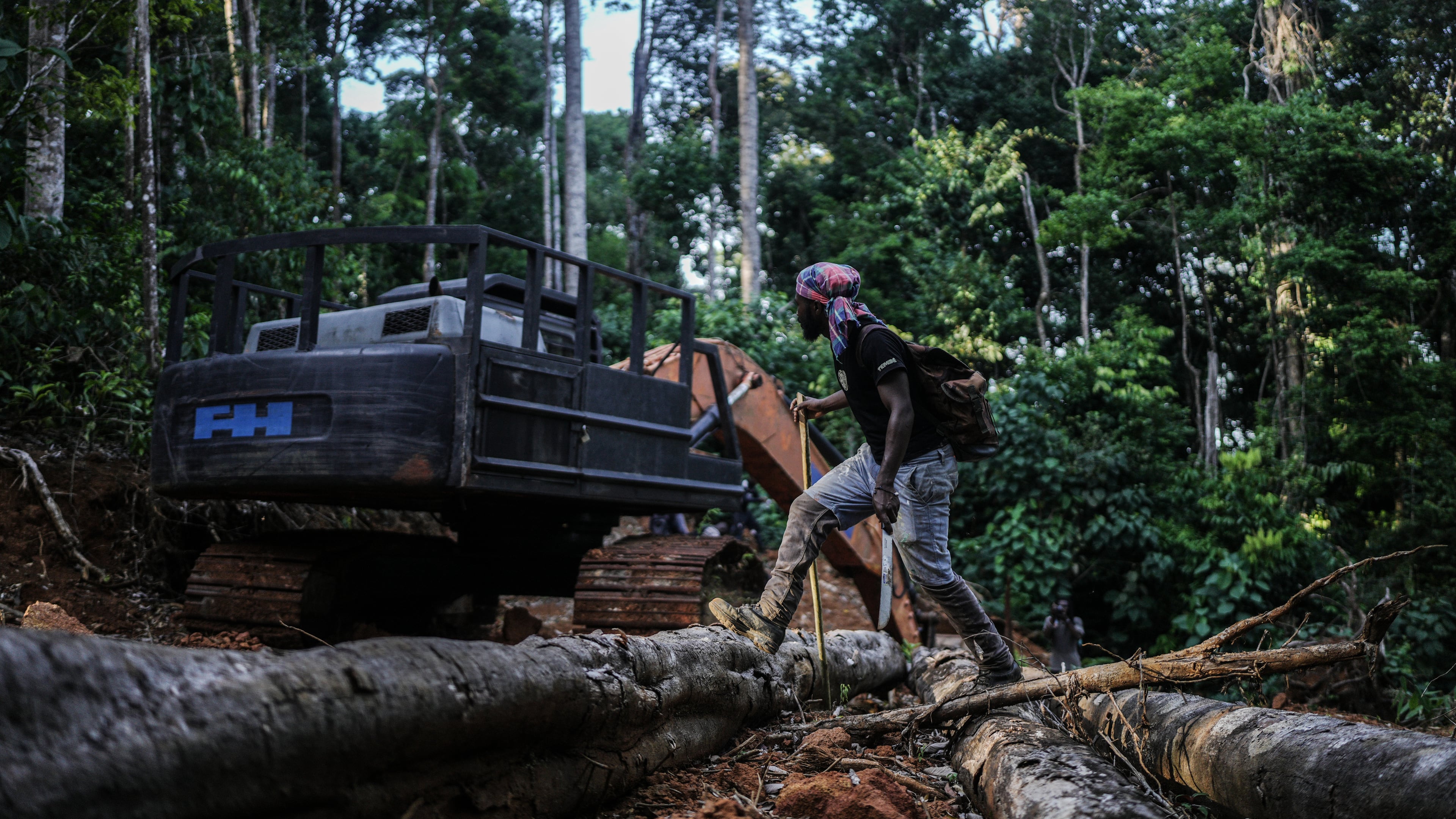Navaldo Vola, a member of the Saamaka community, checks an abandoned excavator from illegal miners in Ebbatop, Suriname, Sunday, Sept. 27, 2026. (AP Photo/Ivan Valencia)