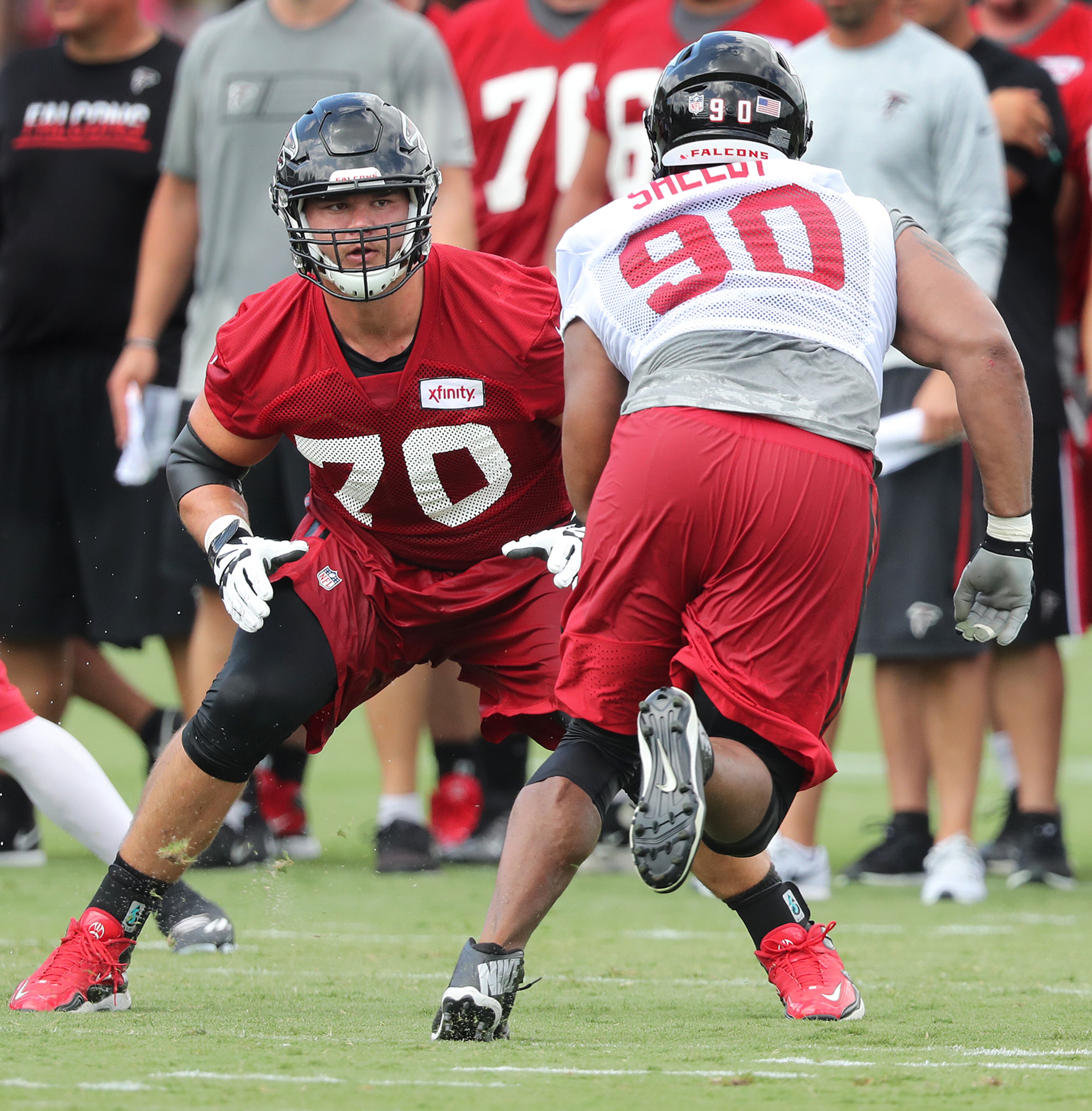 Falcons offensive tackle Jake Matthews looks to block defensive end Derrick Shelby during the first day of training camp on Thursday, July 28, 2016, in Flowery Branch. Curtis Compton /ccompton@ajc.com