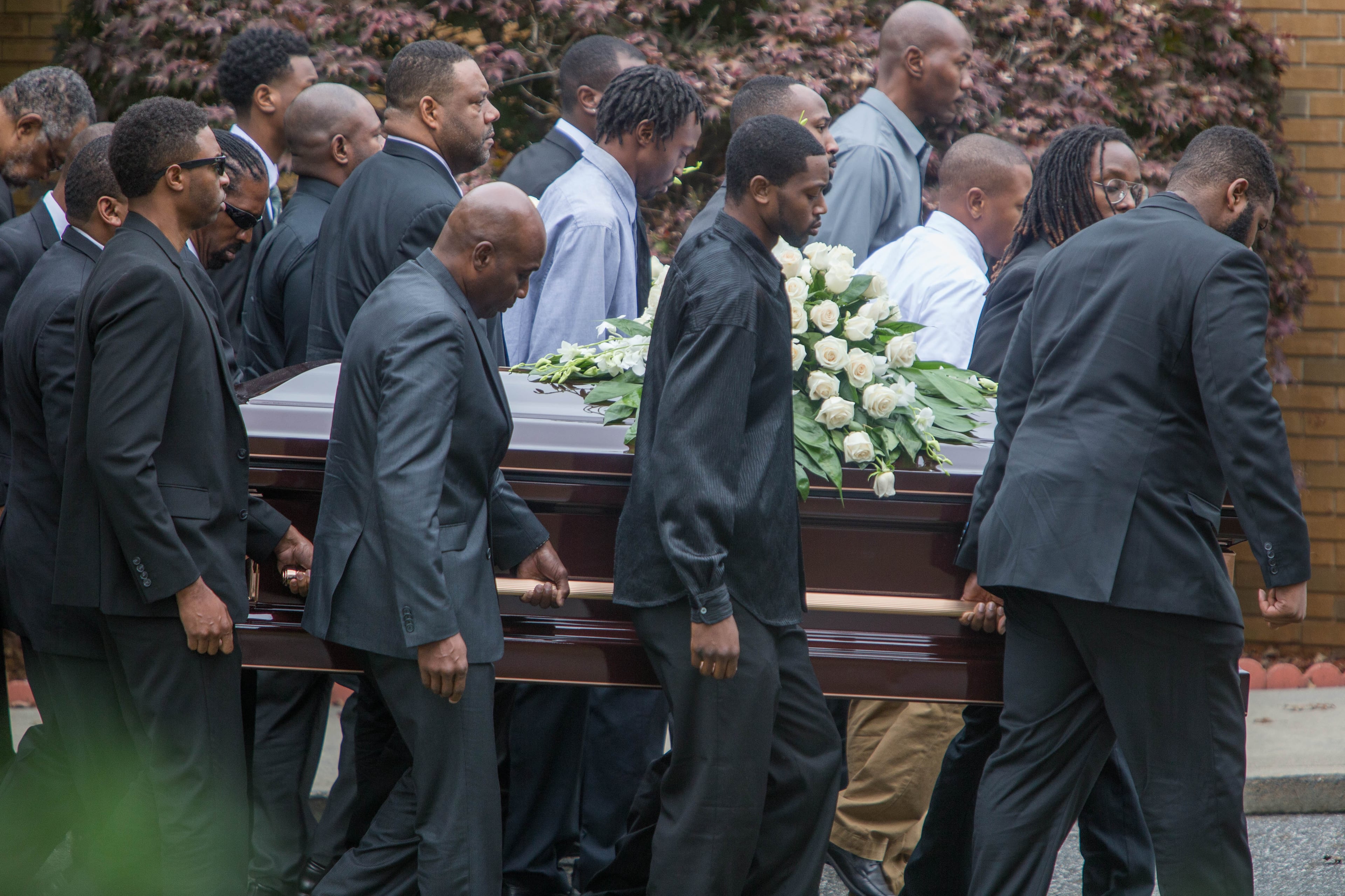 Pall bearers carry the caskets of 17-year-old Jared Brown and his 15-year-old brother Jaison Brown after a funeral service at Lawrenceville Church of God, Saturday, Nov. 7, 2015, in Lawrenceville, Ga. The two brothers were killed in a car accident last Friday morning on Ga. 316 less than two miles from Dacula High School where they attended. BRANDEN CAMP/SPECIAL