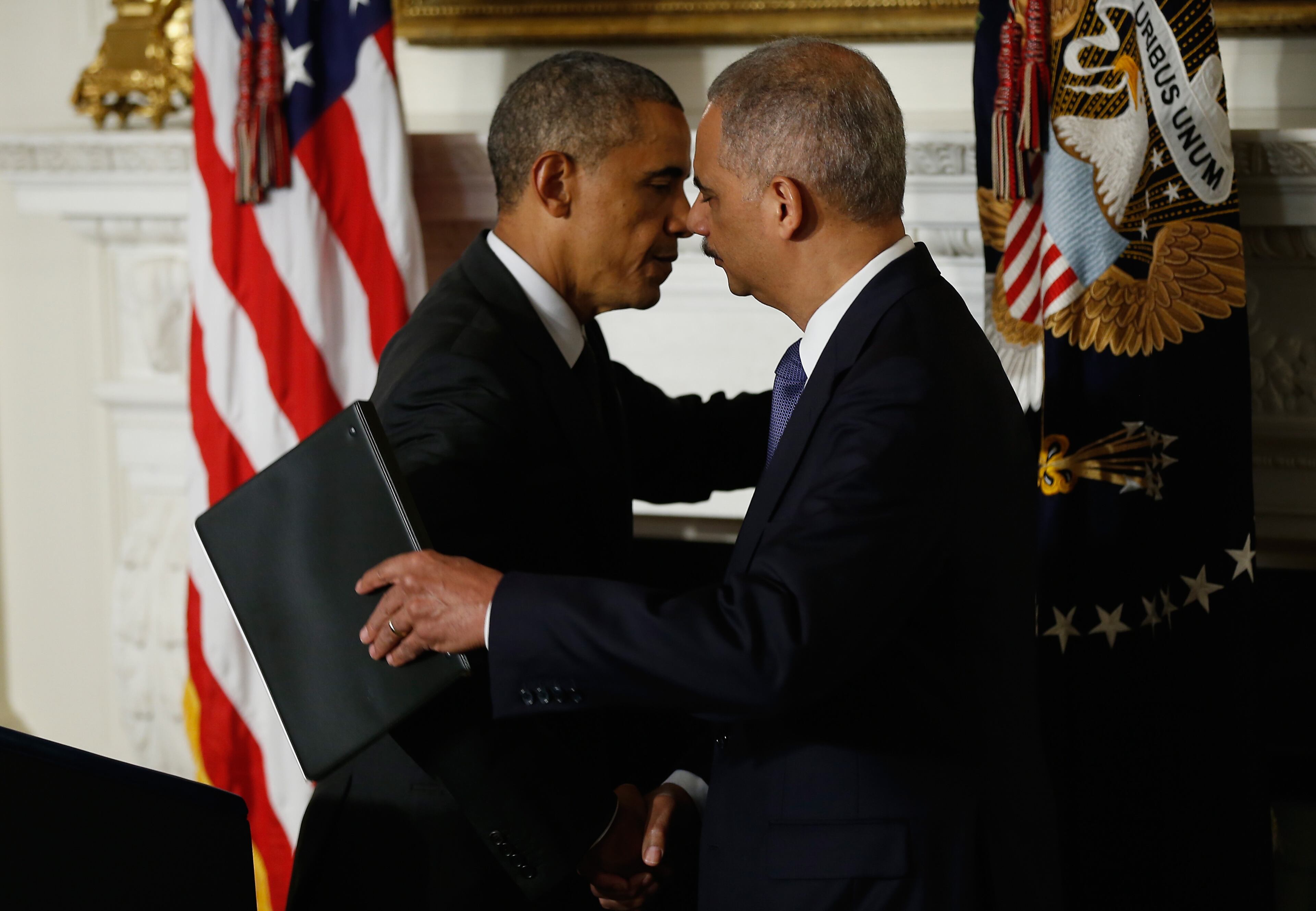 WASHINGTON, DC - SEPTEMBER 25: US President Barack Obama hugs Attorney General Eric H. Holder Jr. who announced his resignation today, September 25, 2014 in Washington, DC. President Obama said that Mr. Holder will remain in office until a successor is nominated and confirmed. (Photo by Win McNamee/Getty Images)