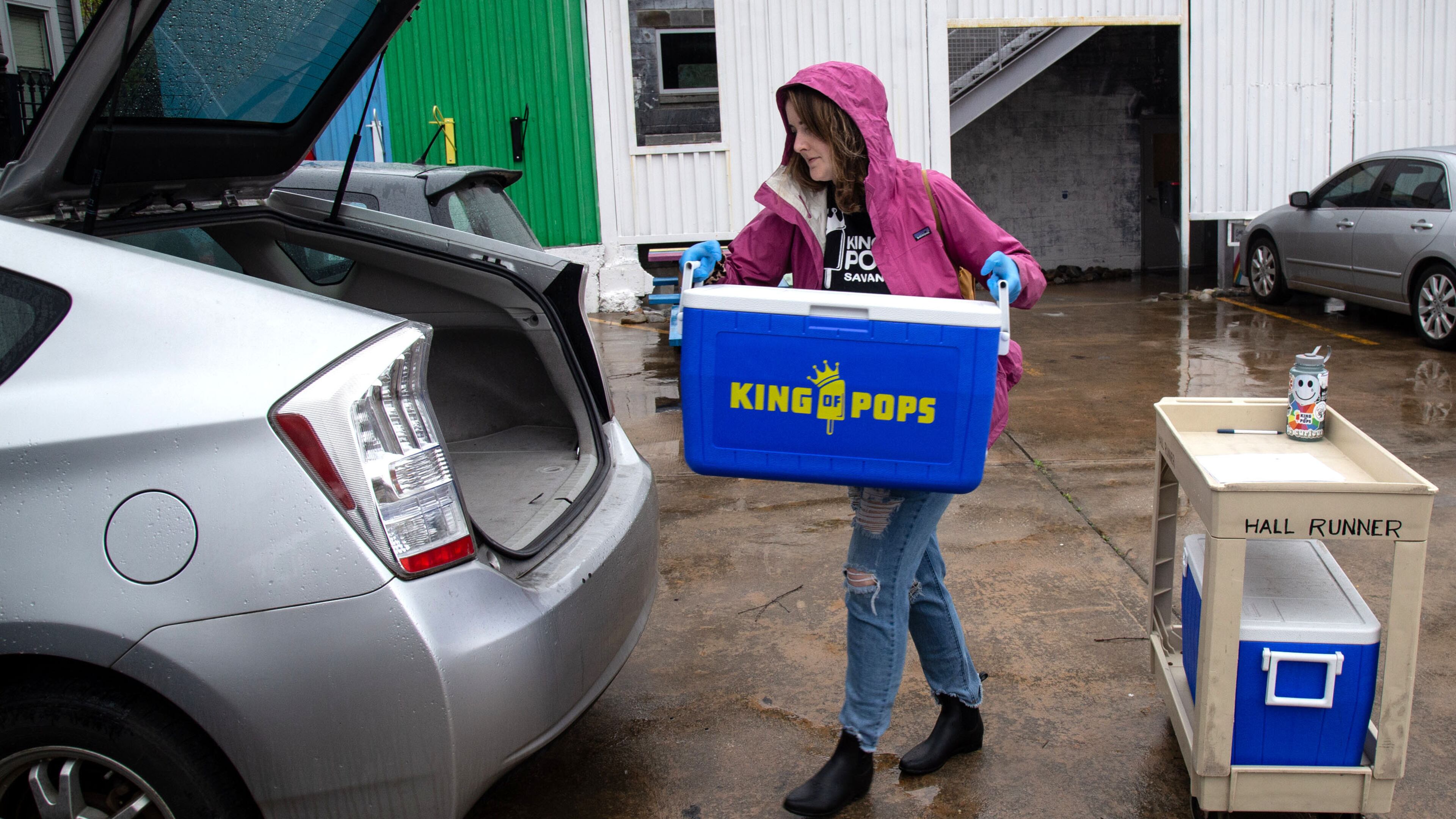 King of Pops Atlanta Territory Operations Manager Alice Diekhoff loads up the car she will use to make her home deliveries at their headquarters on March 23, 2020. King of Pops started home delivery last Wednesday as the coronavirus continued to ravage the state. STEVE SCHAEFER / SPECIAL TO THE AJC