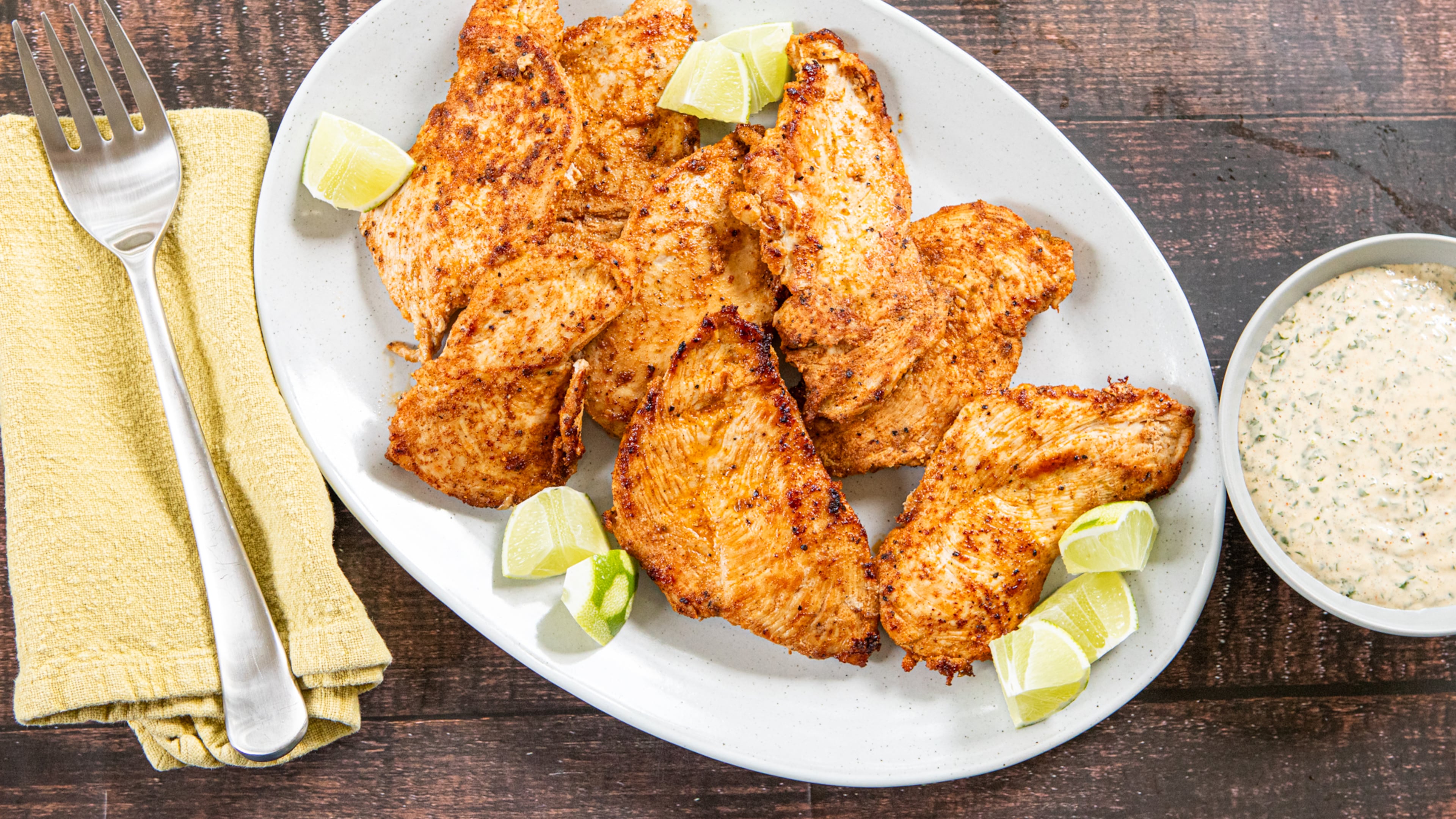 Peruvian-Style Chicken Cutlets with Tangy Herb Dipping Sauce. (Aaliyah Man for the AJC/food styling by Kate Williams)