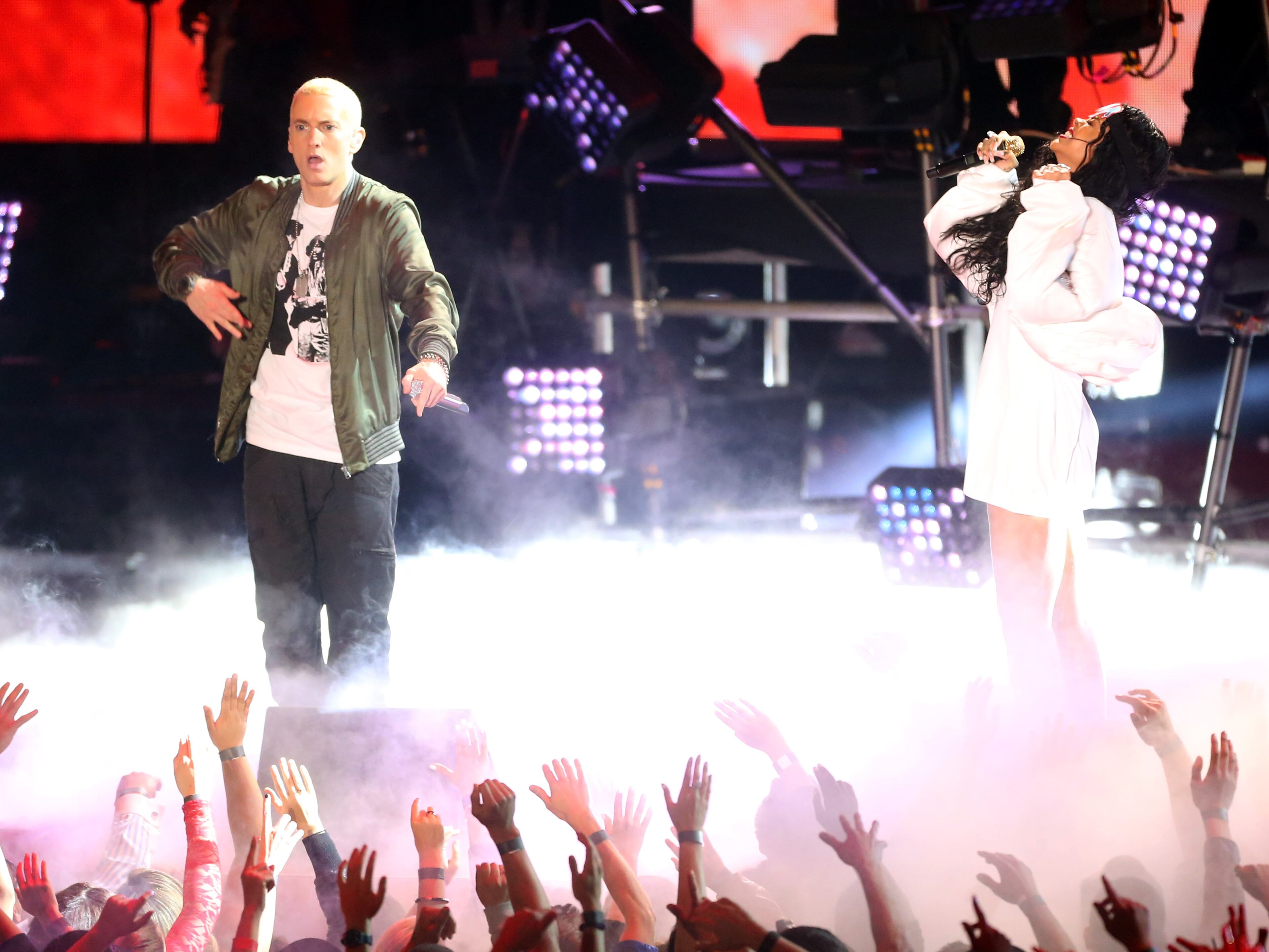 LOS ANGELES, CA - APRIL 13: Rapper Eminem (L) and singer Rihanna perform onstage at the 2014 MTV Movie Awards at Nokia Theatre L.A. Live on April 13, 2014 in Los Angeles, California. (Photo by Frederick M. Brown/Getty Images)
