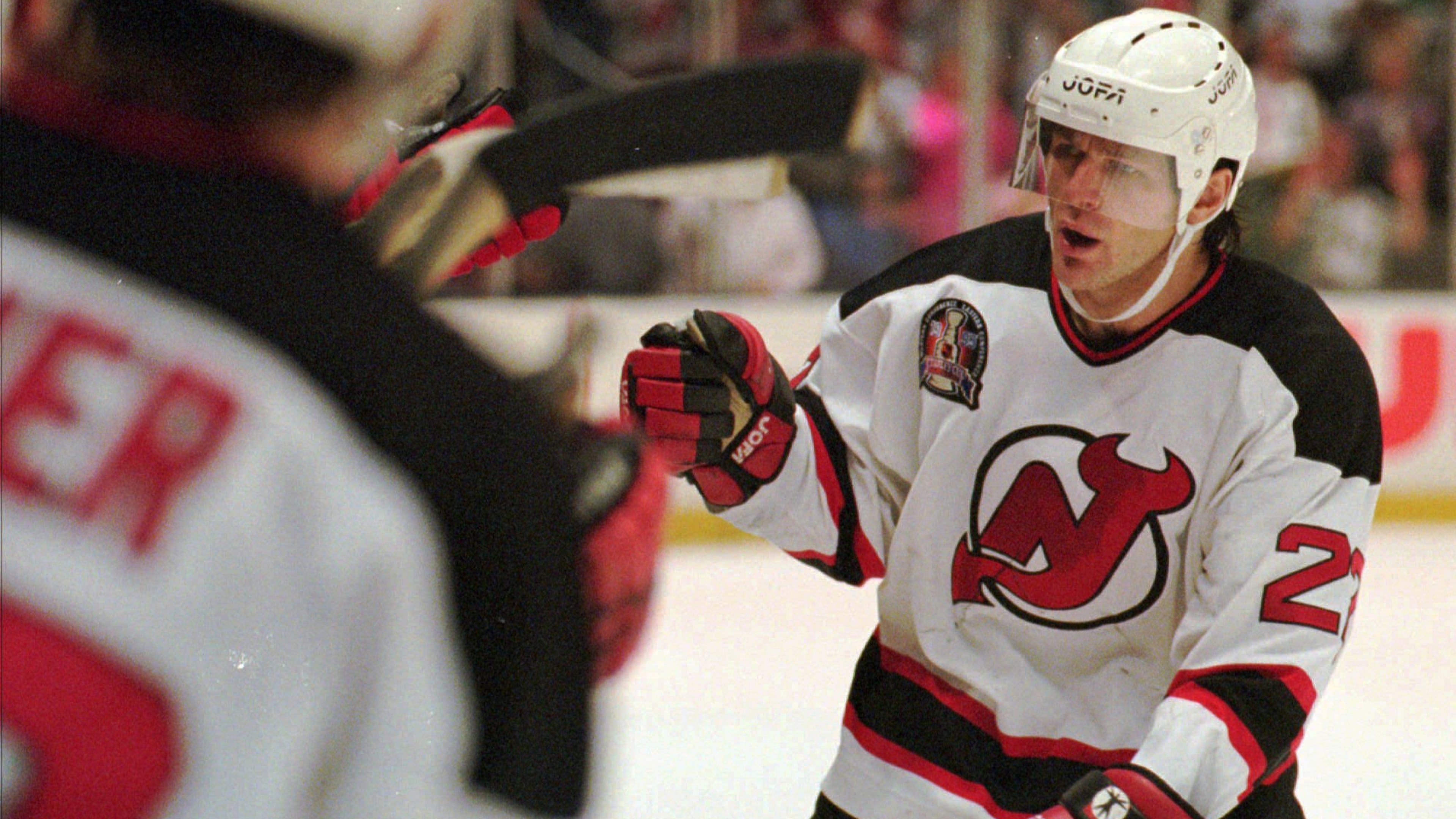 FILE - New Jersey Devils Claude Lemieux is greeted at the bench after scoring a goal in the first period of Game 3 of the NHL Stanley Cup Finals against the Detroit Redwings Thursday, June 22, 1995 at the Meadowlands in East Rutherford, N.J. (AP Photo/Bill Kostroun , File)