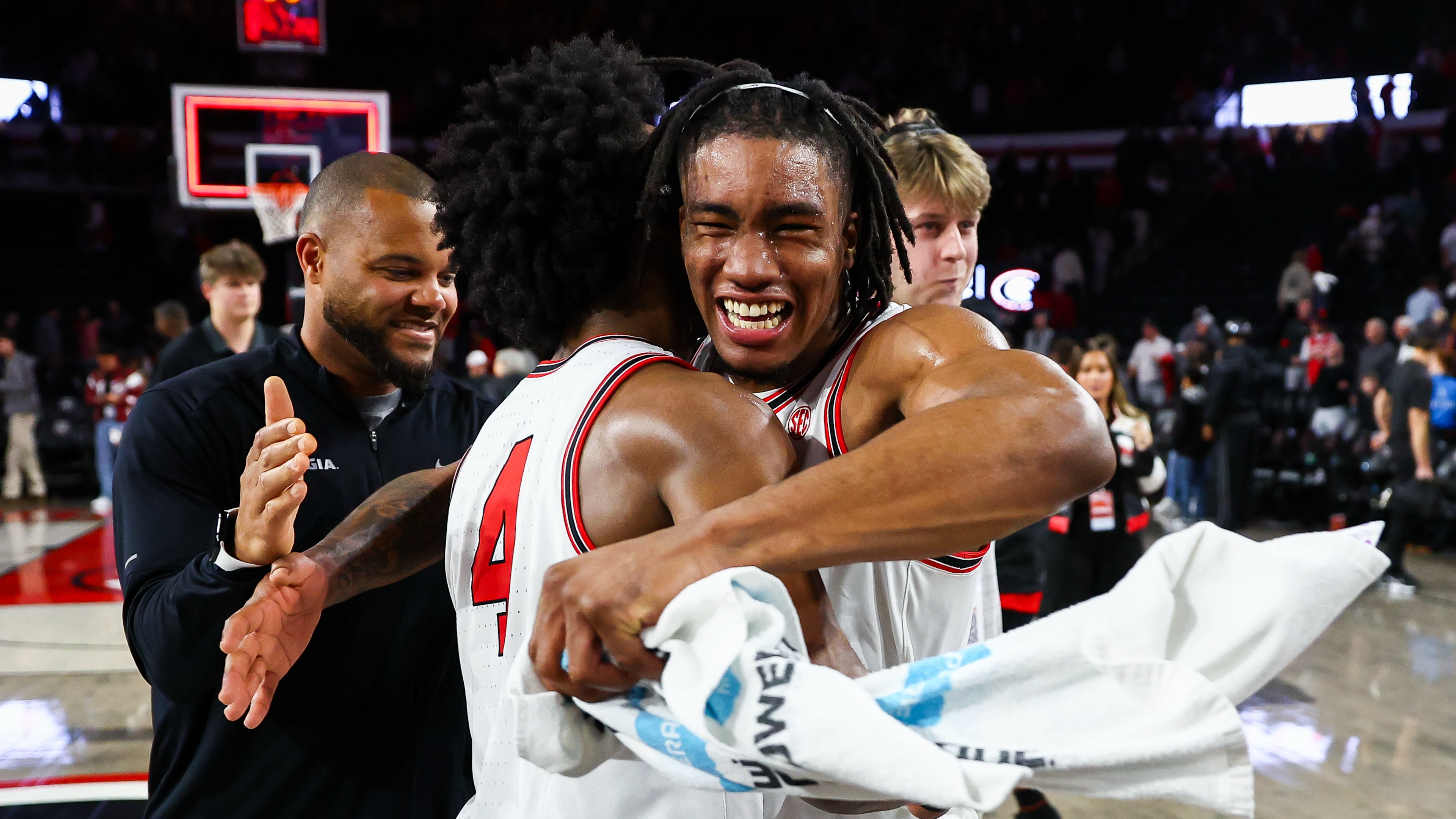 Georgia guard Marcus Millender (front left) hugs guard Jeremiah Wilkinson (right) after an NCAA college basketball game against Auburn, Saturday, Jan. 3, 2026, in Athens, Ga. (Colin Hubbard/AP)