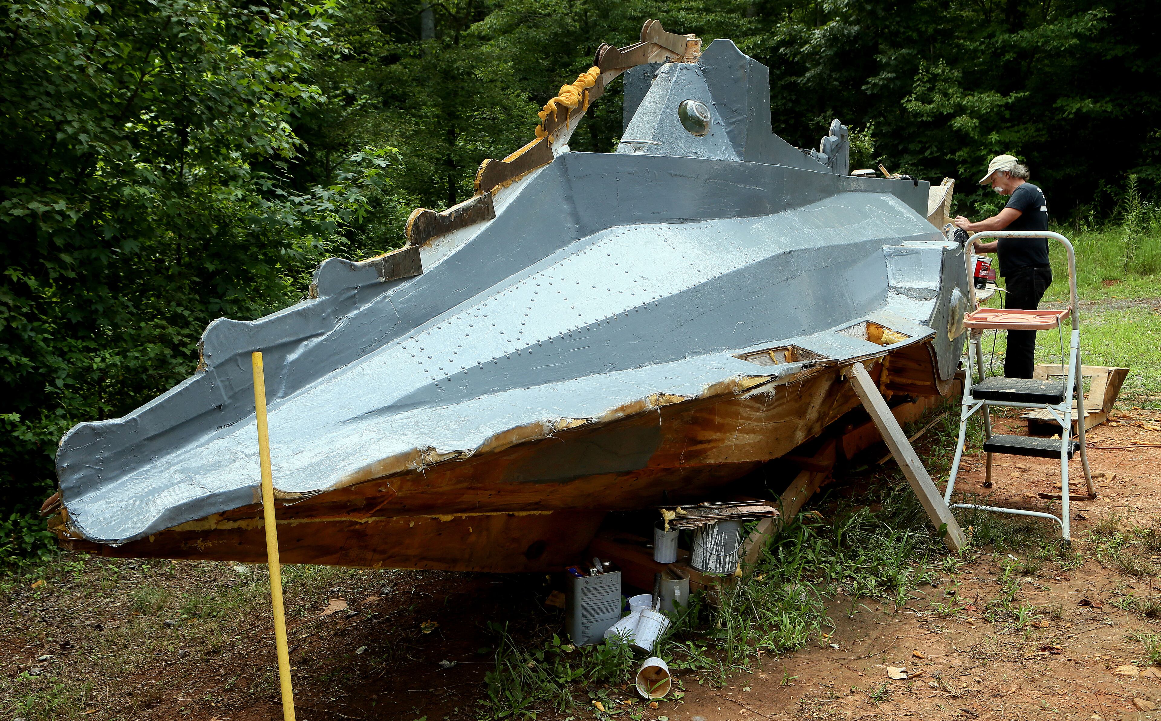 Danny McWilliams works on a 36 foot version of the Nautilus at his Ellijay home on Wednesday July 24th, 2013. The Nautilus is a fantastical machine, piloted by the fanatical Capt. Nemo, in Jules Verne’s "20,000 Leagues Under the Sea.” When he was a kid, McWilliams saw the 1954 film of the same name, a Disney flick starring Kirk Douglas. He had eyes only for the submarine, depicted as a long, finned contraption, the world's largest mechanical fish. To build the vessel He has made innumerable trips to the local Home Depot, loading his Dodge Neon with all the lumber it can handle at one time.