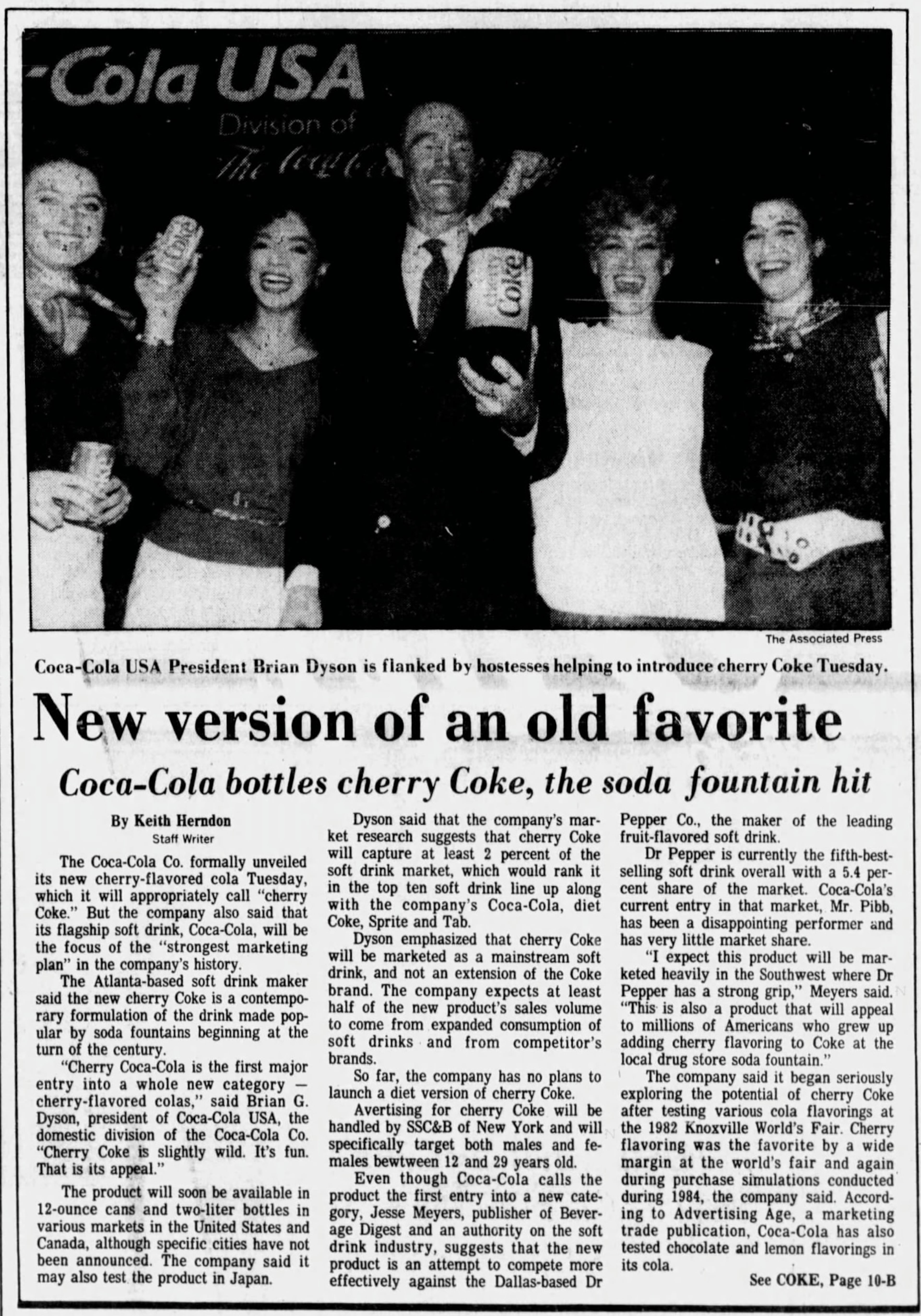 A 1985 article in The Atlanta Constitution shows Brian Dyson "flanked by hostesses" during the launch of Cherry Coke. Dyson said at the time: "Cherry Coca-Cola is the first major entry into a whole new category — cherry-flavored colas. Cherry Coke is slightly wild. It's fun. That is its appeal." (AJC archive)