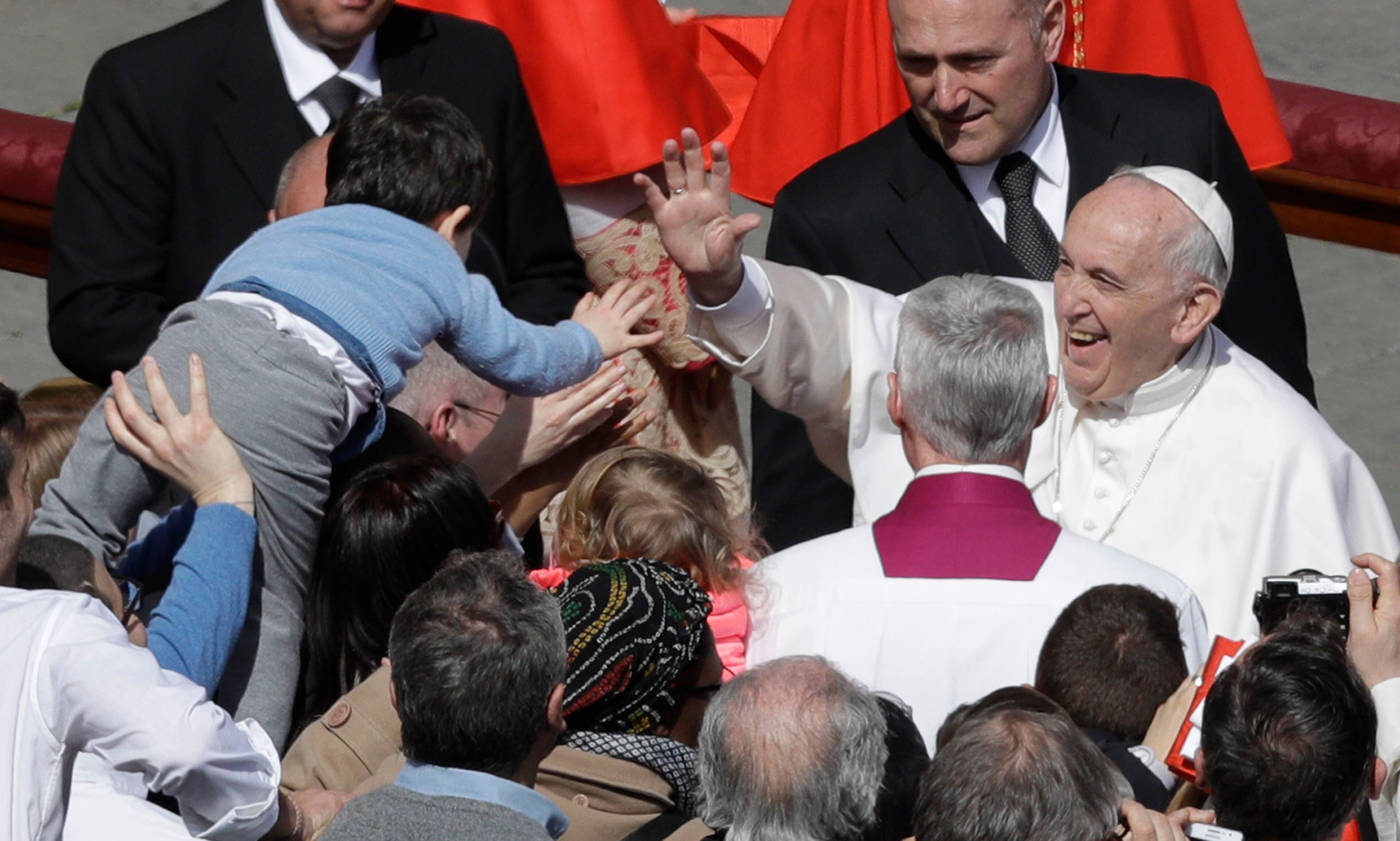 Pope Francis salutes a child after leading the Easter Mass in St. Peter Square at the Vatican, Sunday, April 1, 2018. (AP Photo/Gregorio Borgia)