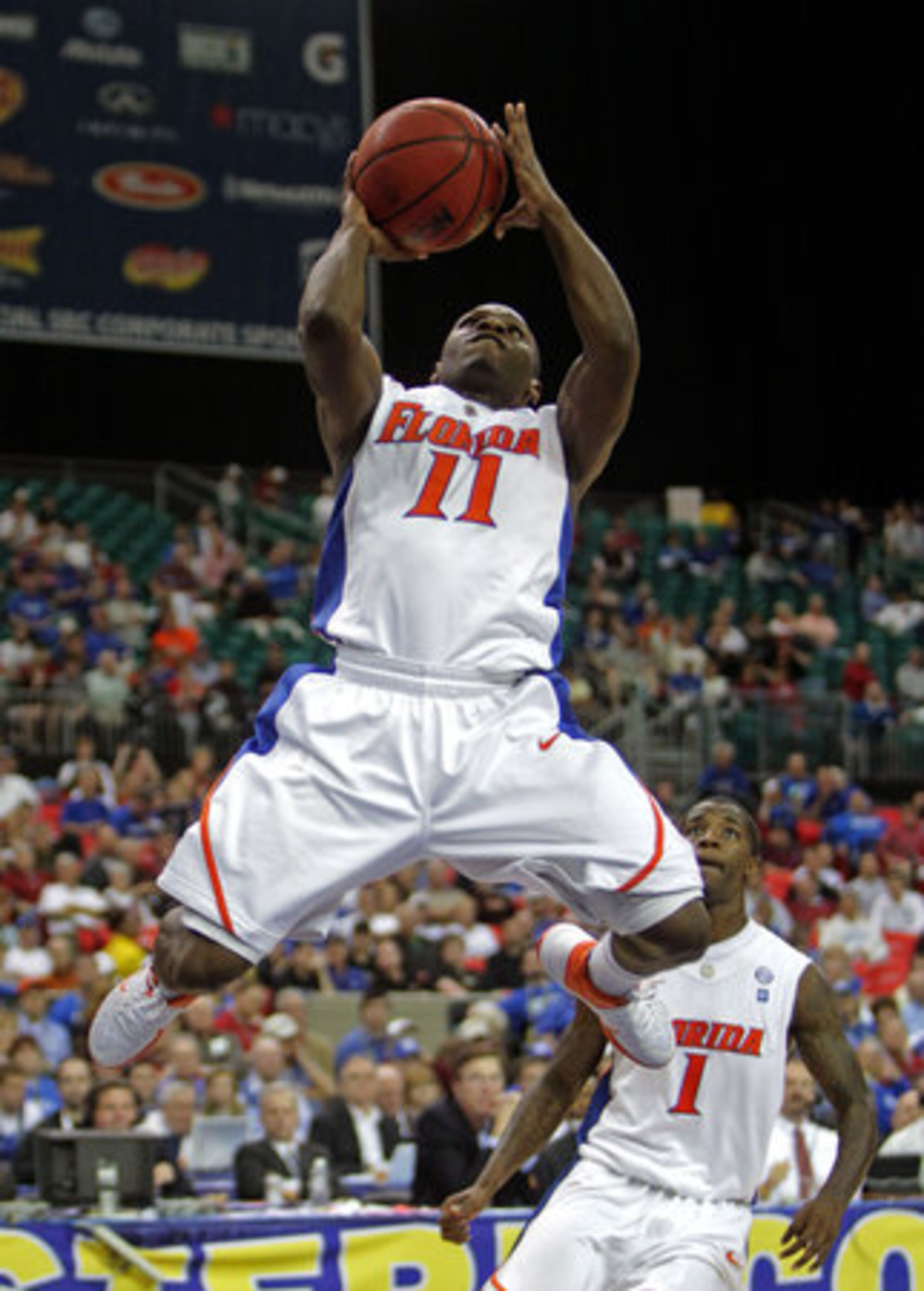 Florida's Erving Walker (11) shoots in the Gators' 77-66 SEC tournament semifinal win over Vanderbilt on Saturday at the Georgia Dome.