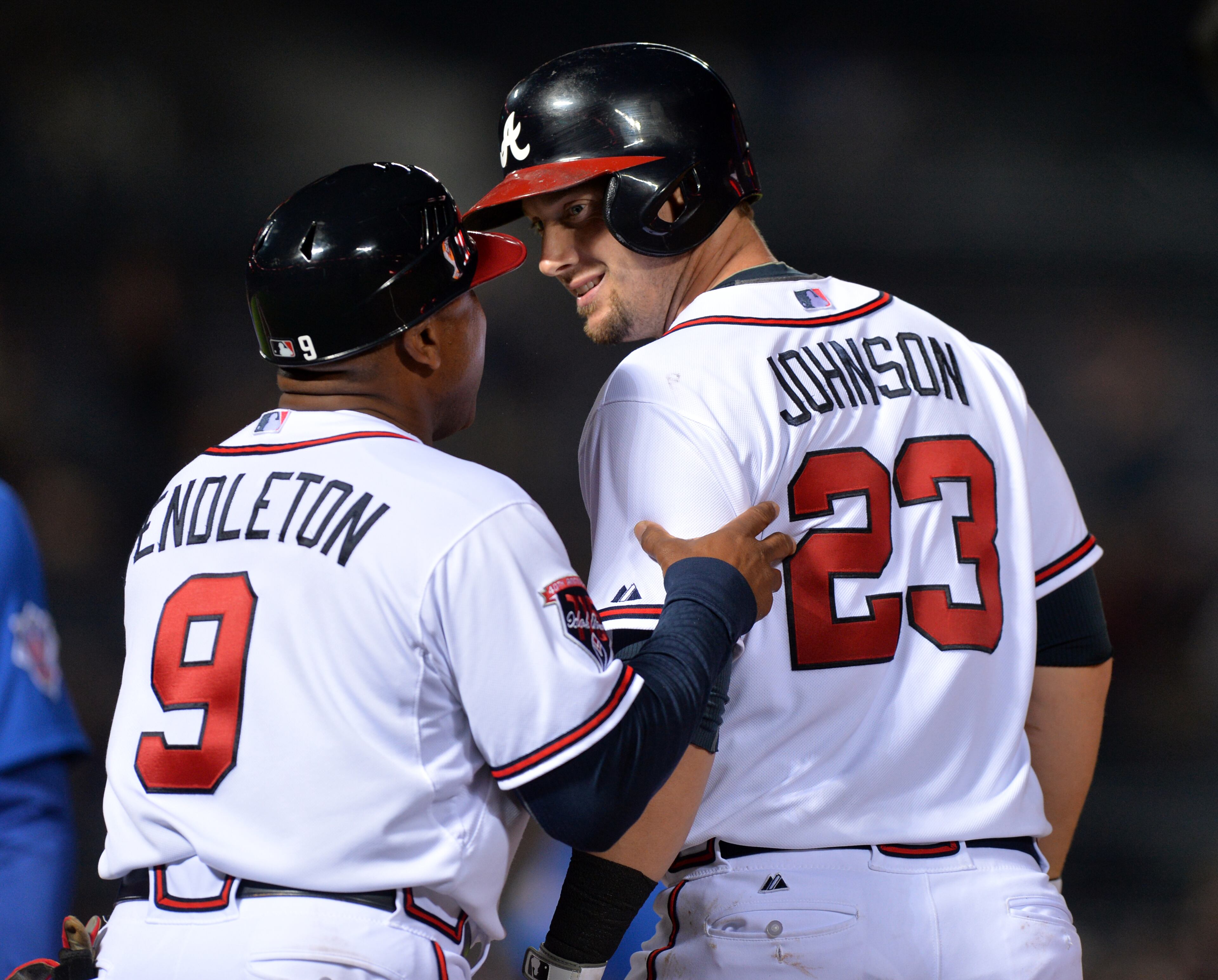 Atlanta Braves Chris Johnson gets a pat on the back from third base coach Terry Pendleton after hitting a two run RBI single in the third inning against the Chicago Cubs tonight Friday May 9. 2014 at Turner Field. BRANT SANDERLIN /BSANDERLIN@AJC.COM
