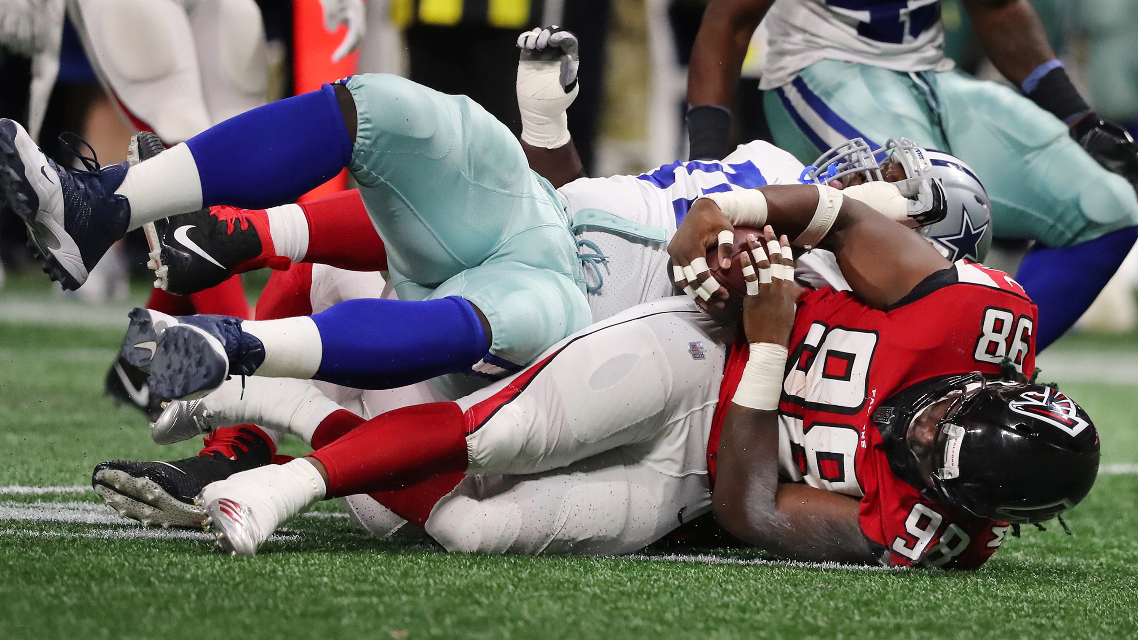 Falcons defensive end Takkarist McKinley recovers a Cowboys fumble during the fourth quarter in a NFL football game on Sunday, November 12, 2017, in Atlanta. Curtis Compton/ccompton@ajc.com