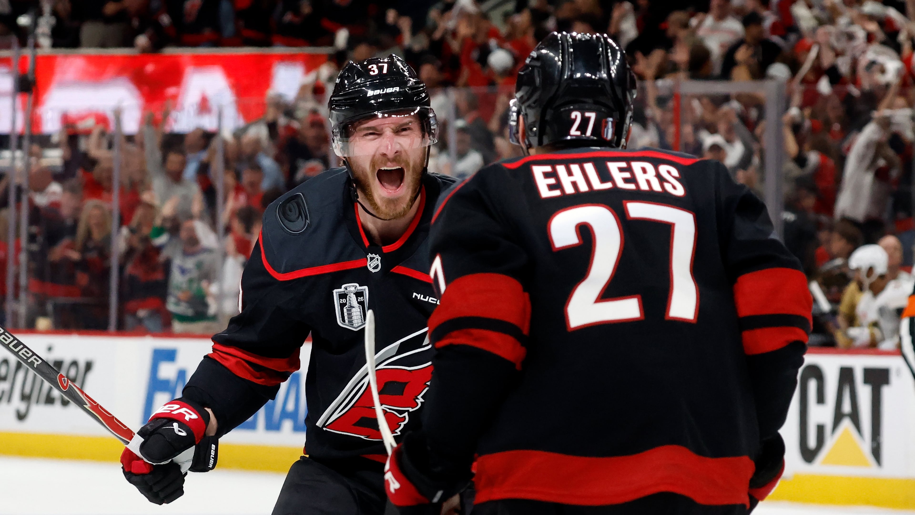 Carolina Hurricanes' Andrei Svechnikov (37) celebrates after his goal with Nikolaj Ehlers (27) during the second period in Game 5 of the NHL hockey Stanley Cup Final series against the Vegas Golden Knights in Raleigh, N.C., Thursday, June 11, 2026. (AP Photo/Karl DeBlaker)