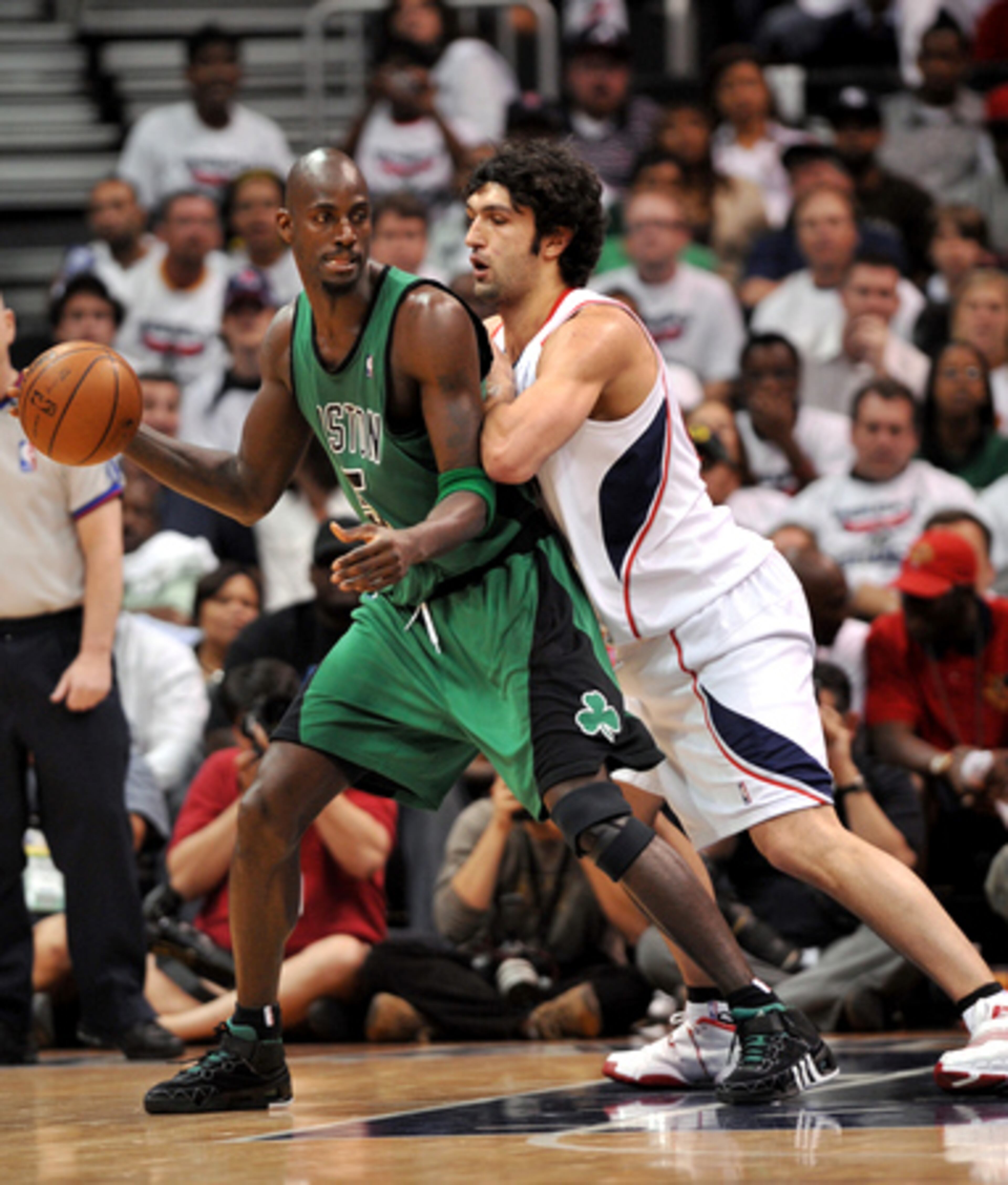 Hawks center Zaza Pachulia plays some tight defense on Celtics forward Kevin Garnett.