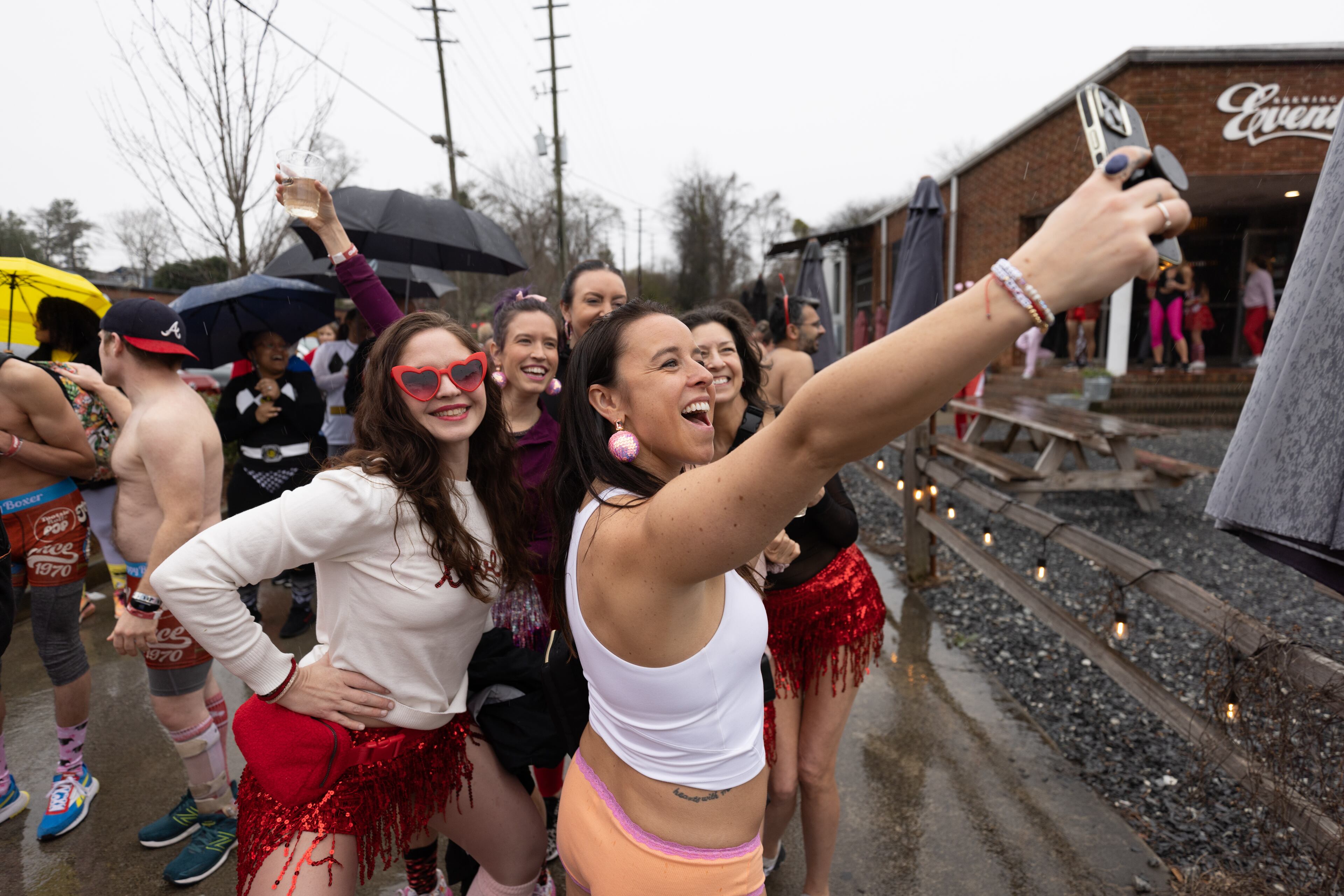 Race participants take a selfie before the start of the Cupid's Undie Run Atlanta 2023 on Saturday afternoon, Feb. 11, 2023. Runners raise funds to support people affected by the genetic disorder neurofibromatosis. (Photo: Steve Schaefer / steve.schaefer@ajc.com)