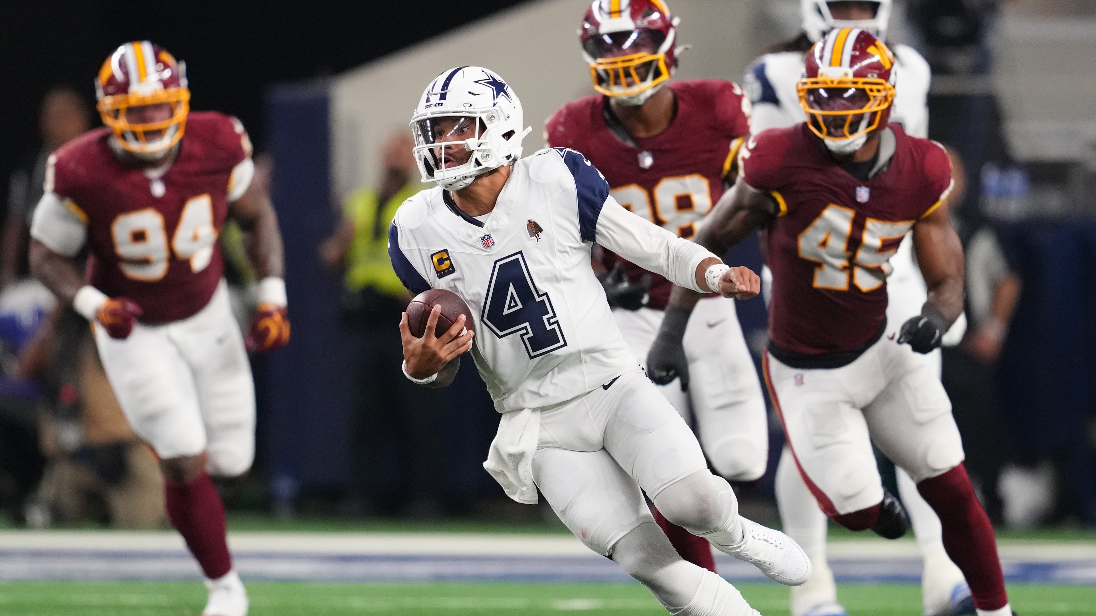 Dallas Cowboys quarterback Dak Prescott (4) runs against the Washington Commanders in the second half during an NFL football game in Arlington, Texas, Sunday, Sept. 20, 2026. (AP Photo/Tony Gutierrez)