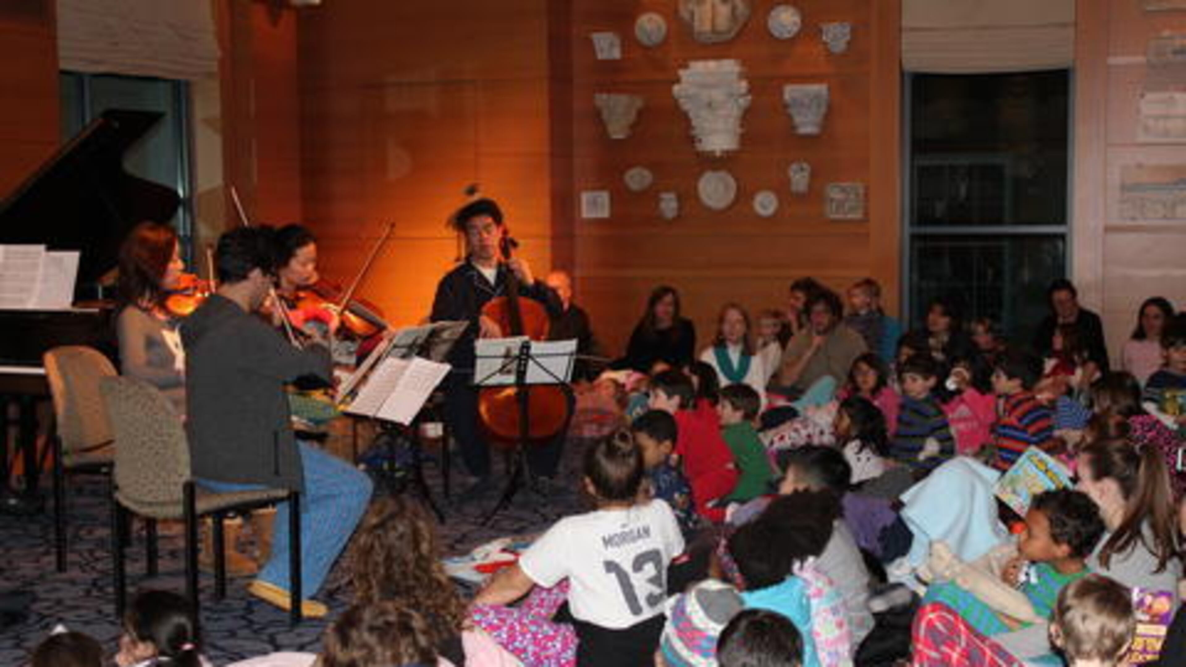Children enjoy chamber music at the Carlos Museum.