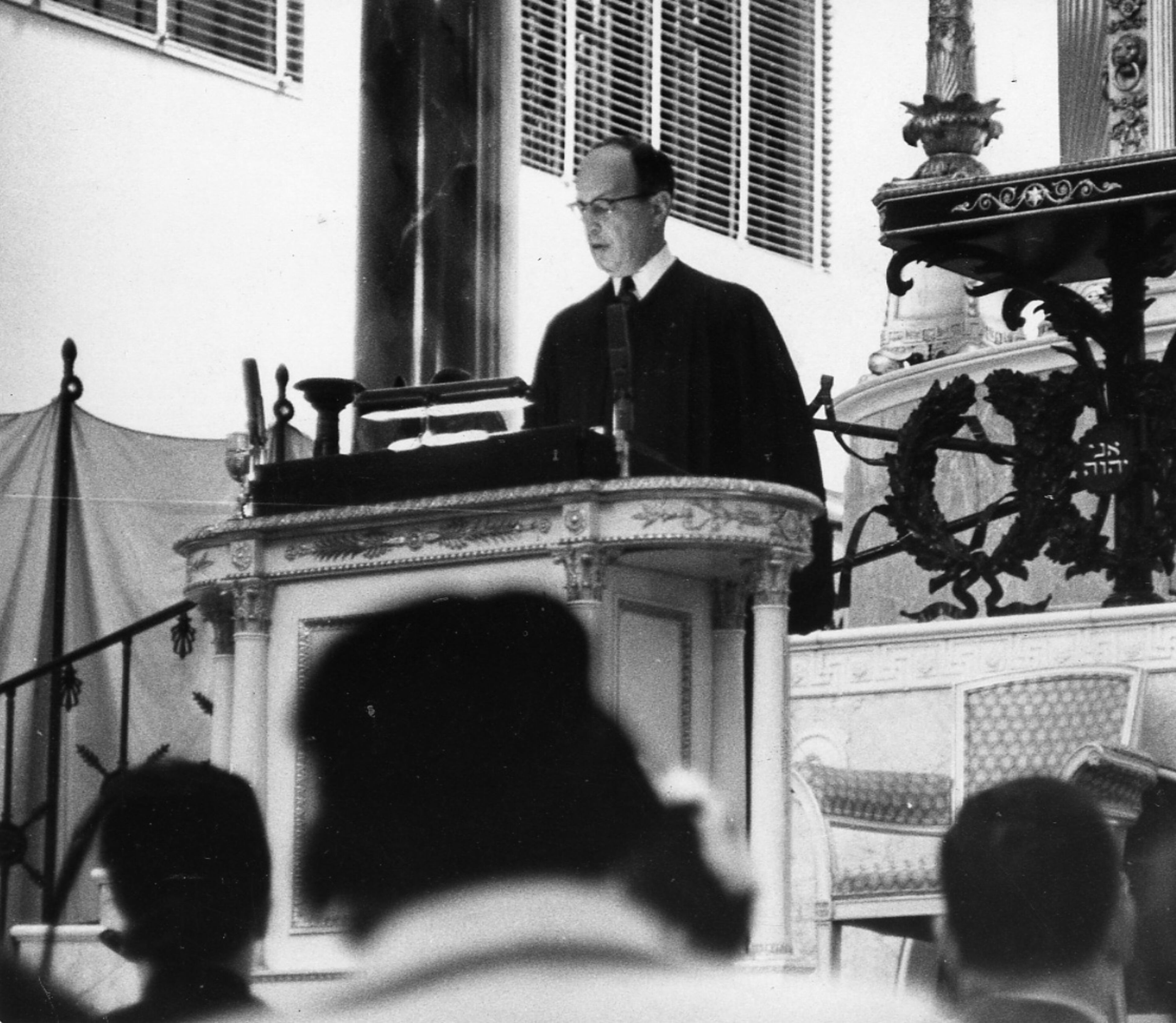 Rabbi Jacob Rothschild holds the first Sabbath service since the bombing; says "humanity, we shall rear from the rubble..." (Dwight Ross / AJC staff) 1958