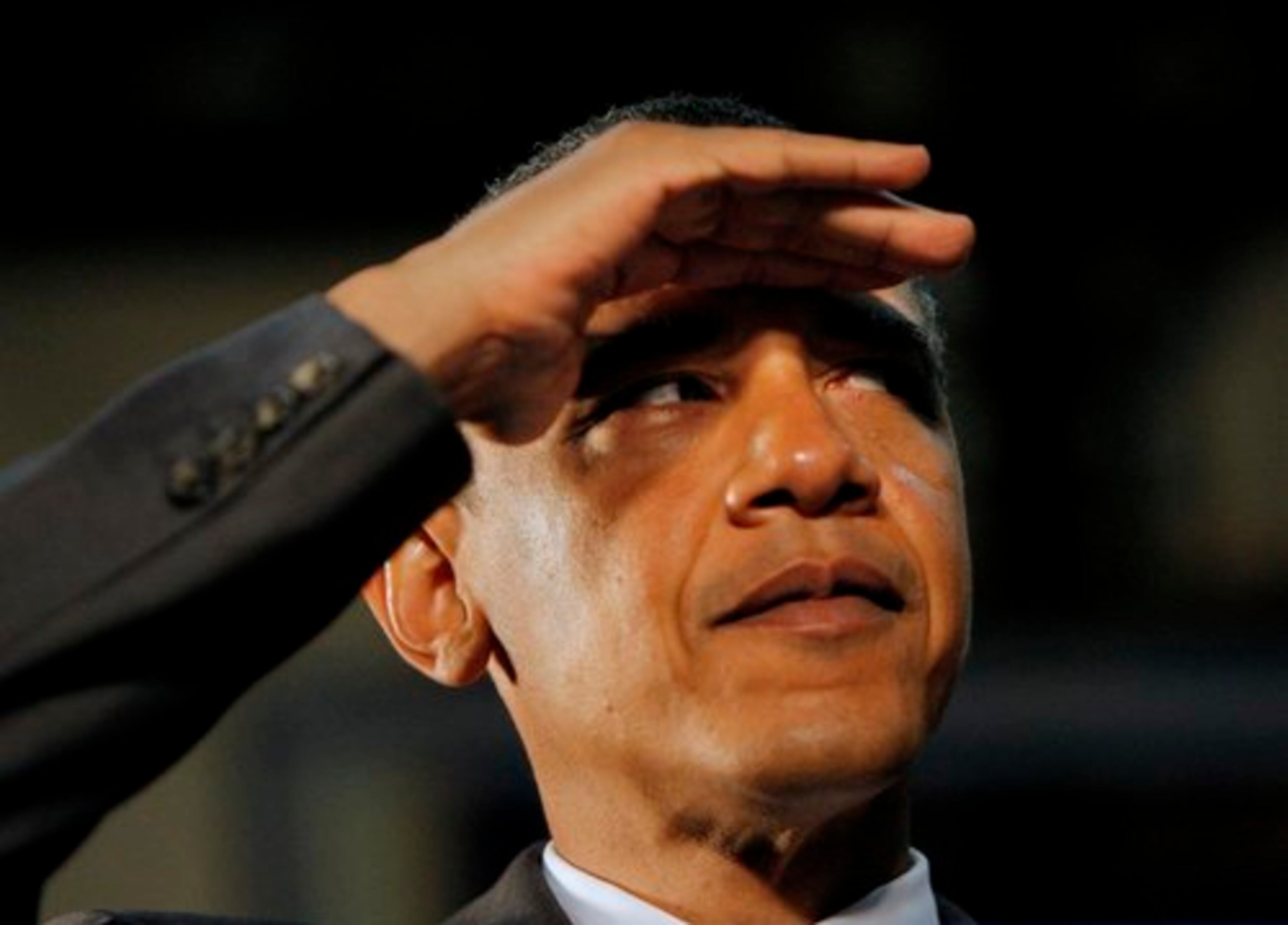 Sen. Barack Obama shields his eyes during a town hall-style meeting held Tuesday in Powder Springs.
