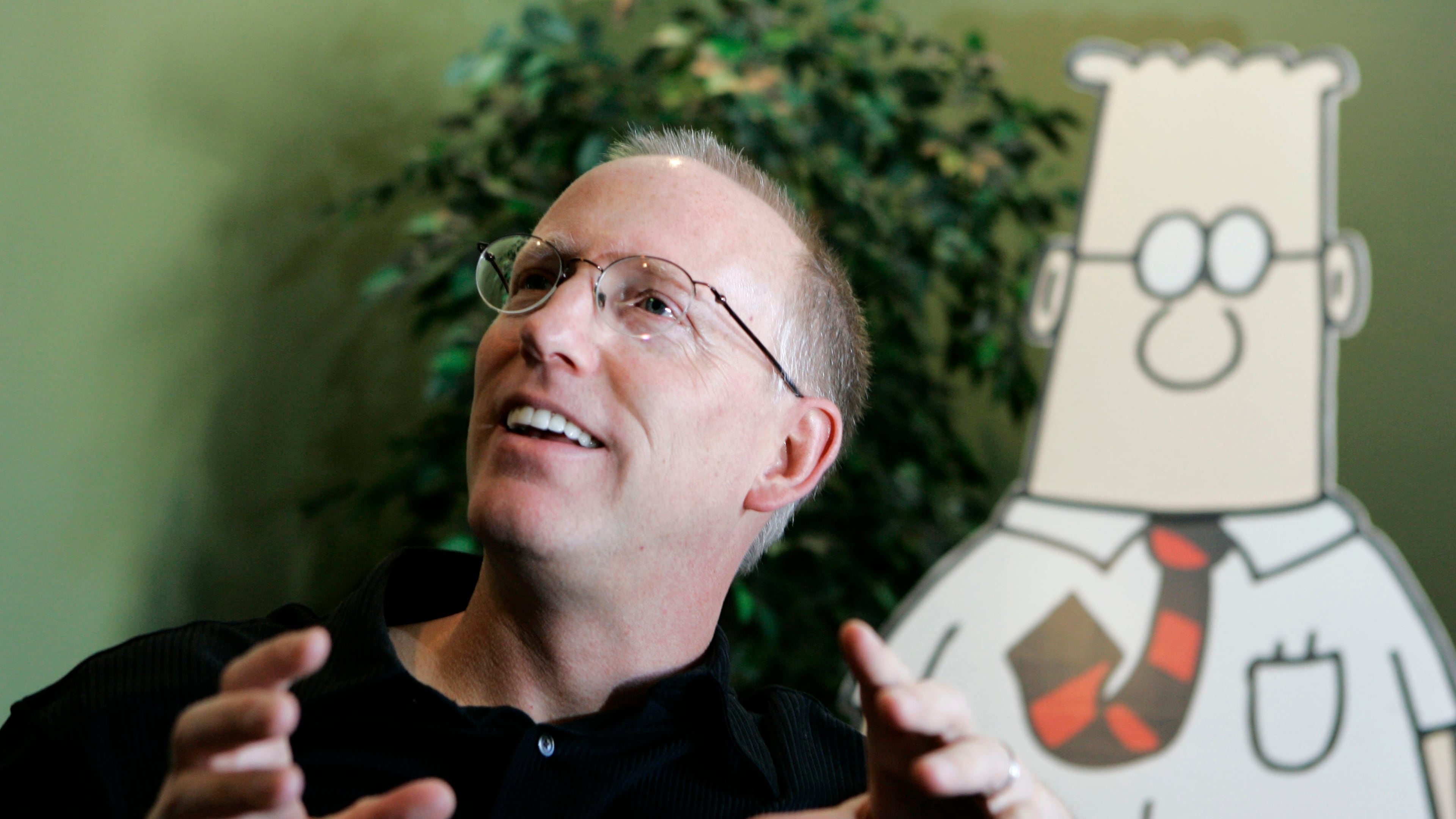 FILE - Scott Adams, creator of the comic strip Dilbert, talks about his work at his studio in Dublin, Calif., on Oct. 26, 2006. (AP Photo/Marcio Jose Sanchez, File)