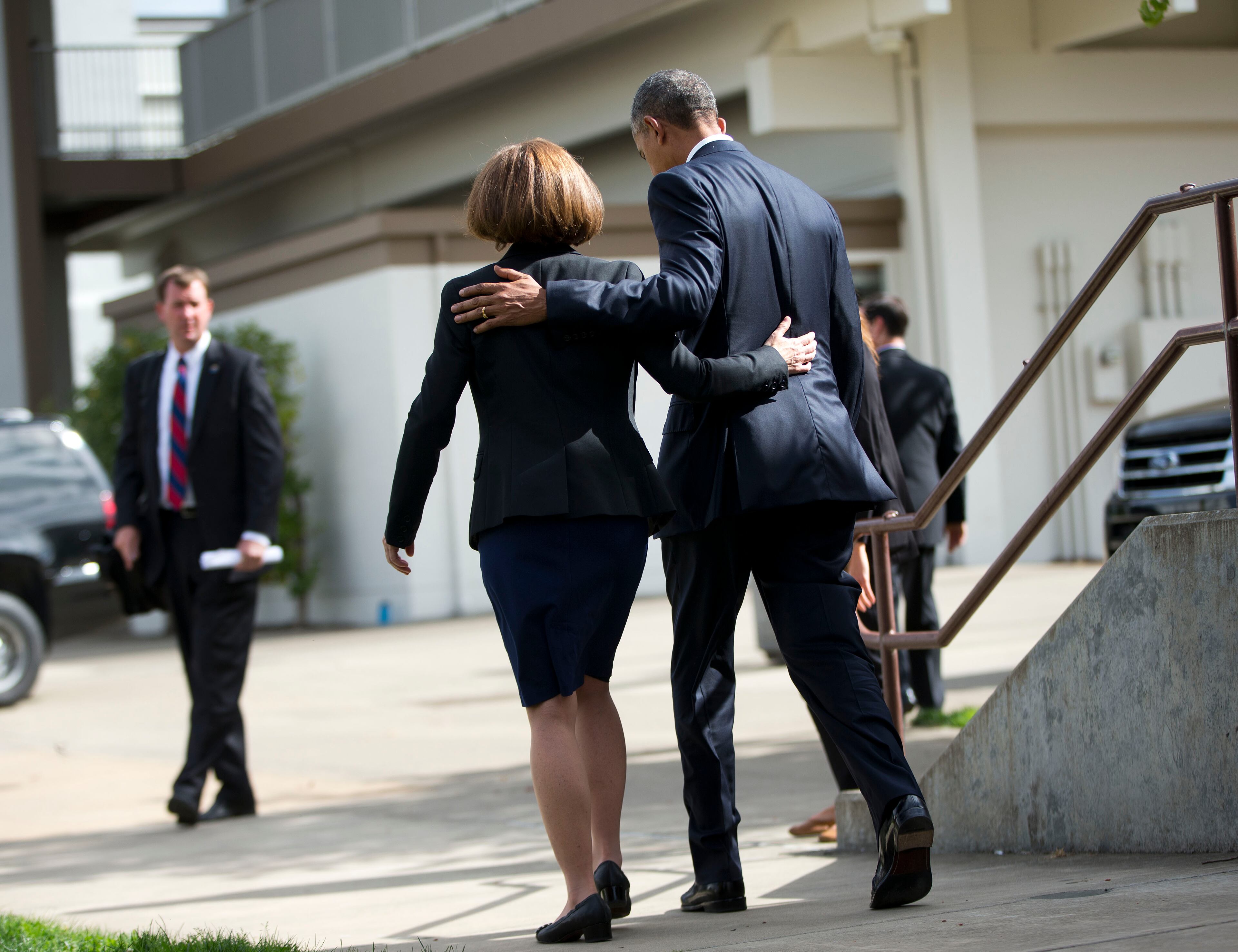 President Barack Obama and Oregon Gov. Kate Brown, walk back to the motorcade following their meeting with families of the victims of the Oct. 1, shooting at Umpqua Community College, Friday, Oct. 9, 2015 in Roseburg, Ore. (AP Photo/Pablo Martinez Monsivais)