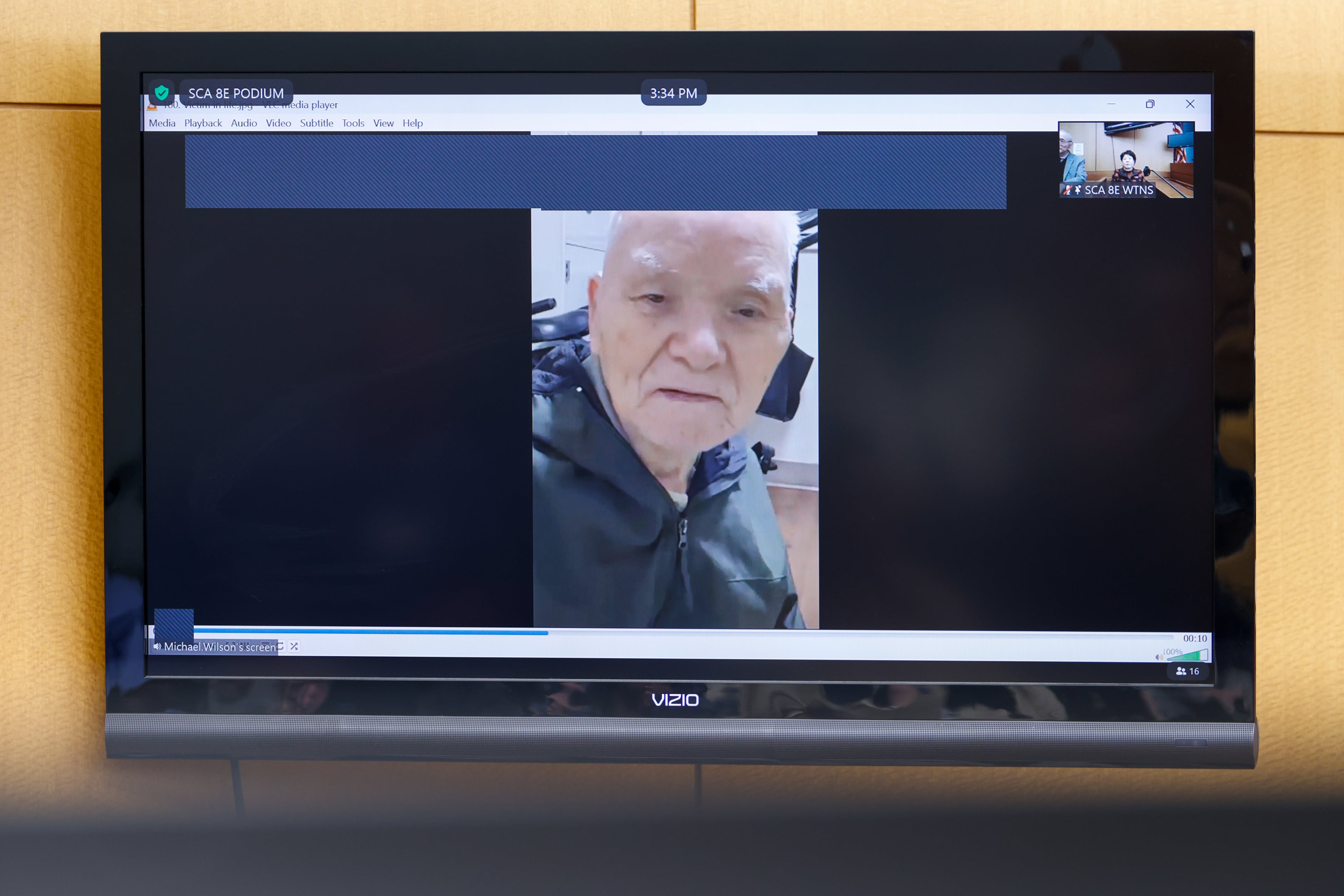 A picture Chun Ki Kim is shown on the screen during Janet Williams’ criminal trial at the Fulton County Courthouse in Atlanta on Tuesday, Feb. 24, 2026. (Arvin Temkar/AJC)