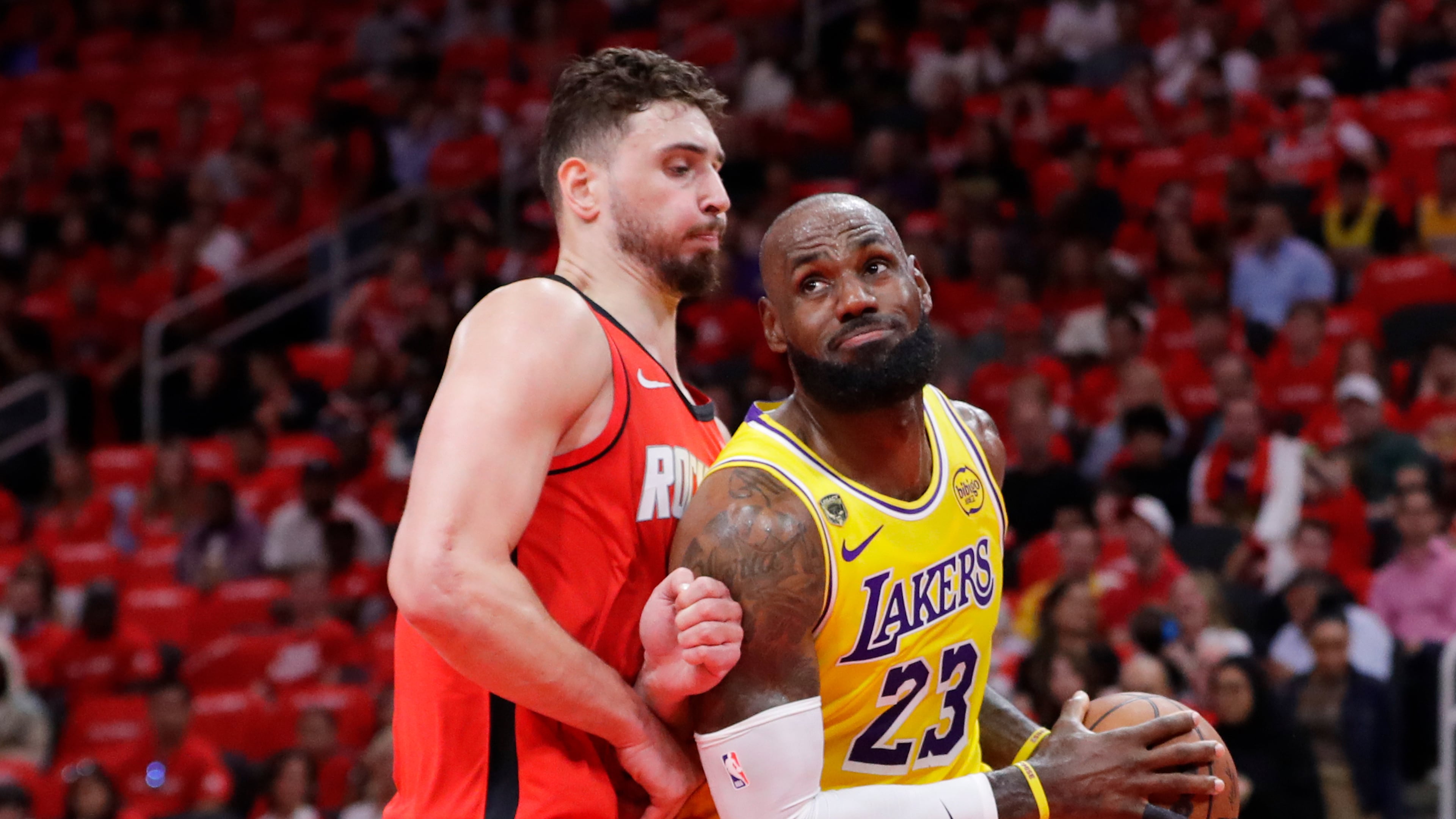 Los Angeles Lakers forward LeBron James (23) drives to the basket in front of Houston Rockets center Alperen Sengun, left, during the first half of Game 3 in a first-round NBA playoffs basketball series Friday April 24, 2026, in Houston. (AP Photo/Michael Wyke)