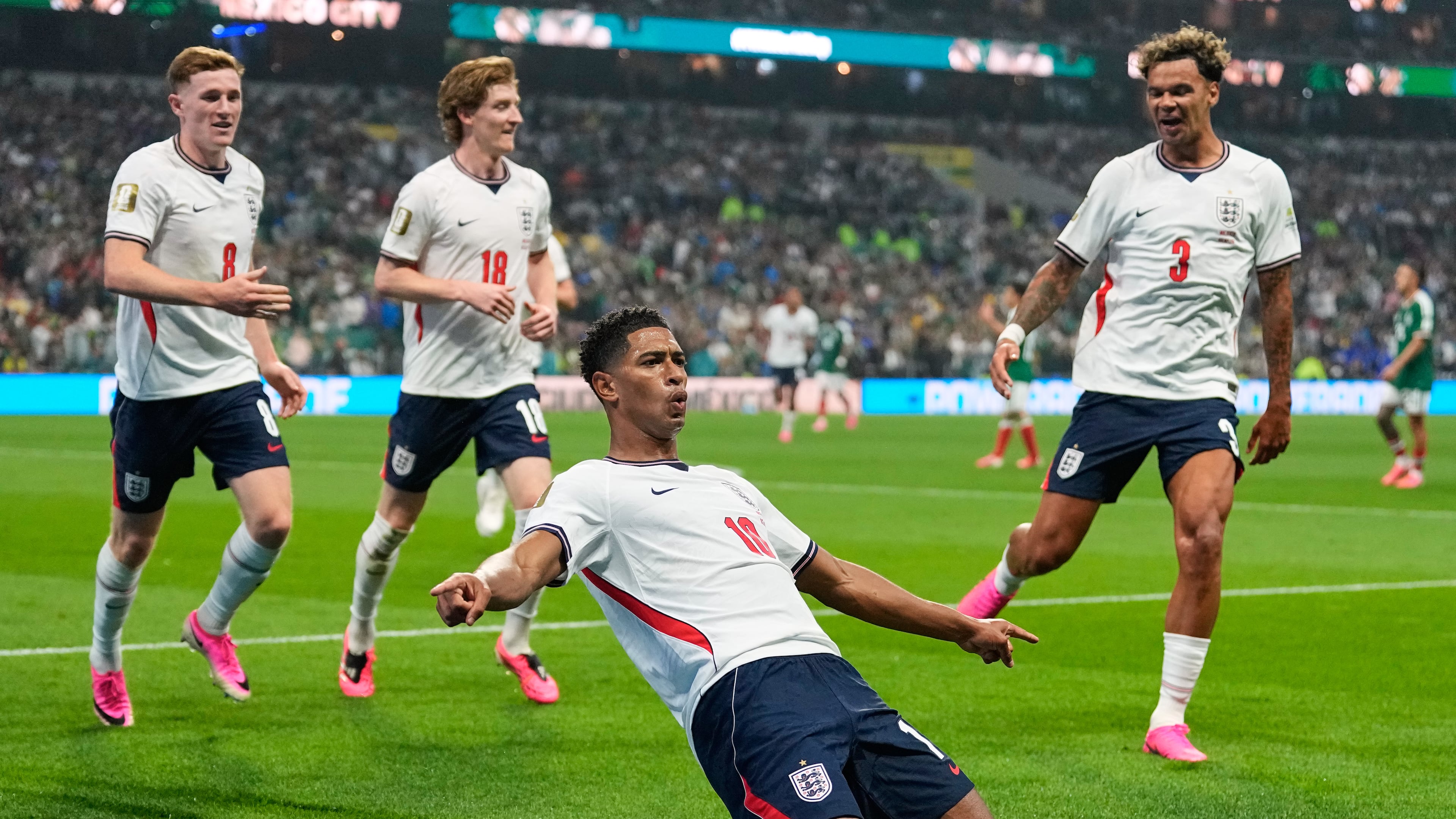England's Jude Bellingham (10) celebrates with teammates after scoring his second goal during the World Cup round of 16 soccer match between Mexico and England in Mexico City, Sunday, July 5, 2026. (AP Photo/Natacha Pisarenko)