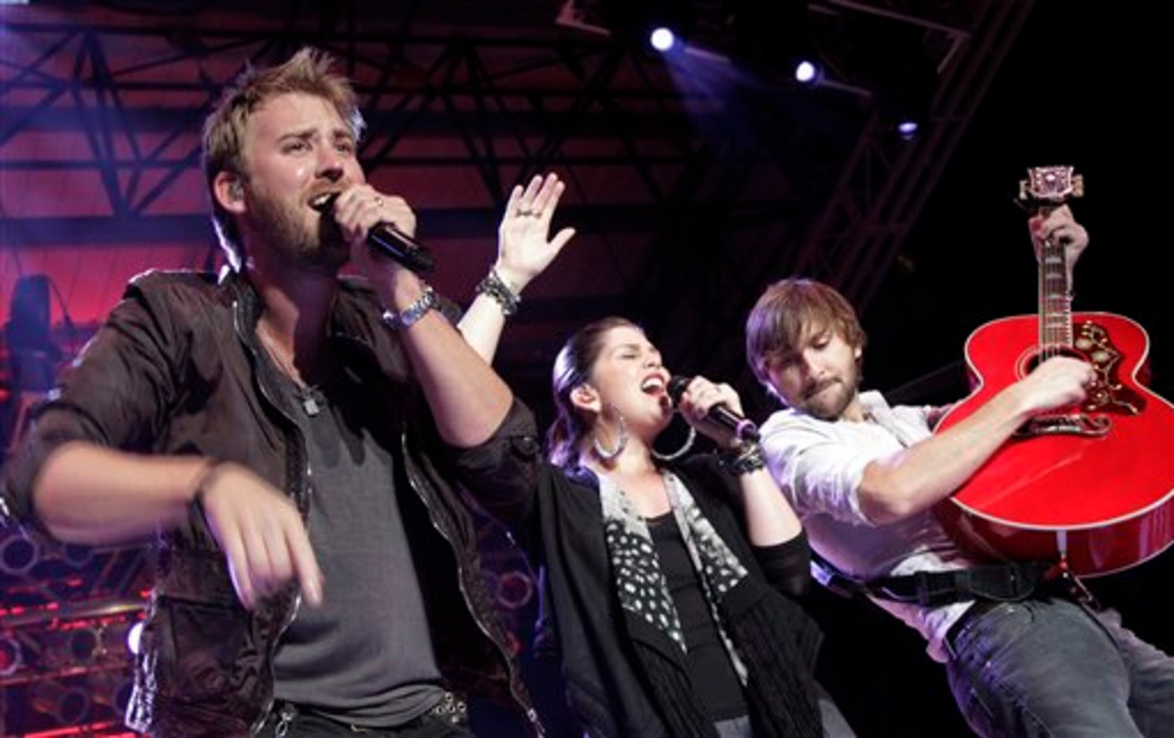 Charles Kelley, left, Hillary Scott and Dave Haywood, of the country music group Lady Antebellum, are seen performing in Paso Robles, Calif., Thursday, July 28, 2011. (Michael A. Mariant/via AP Images)