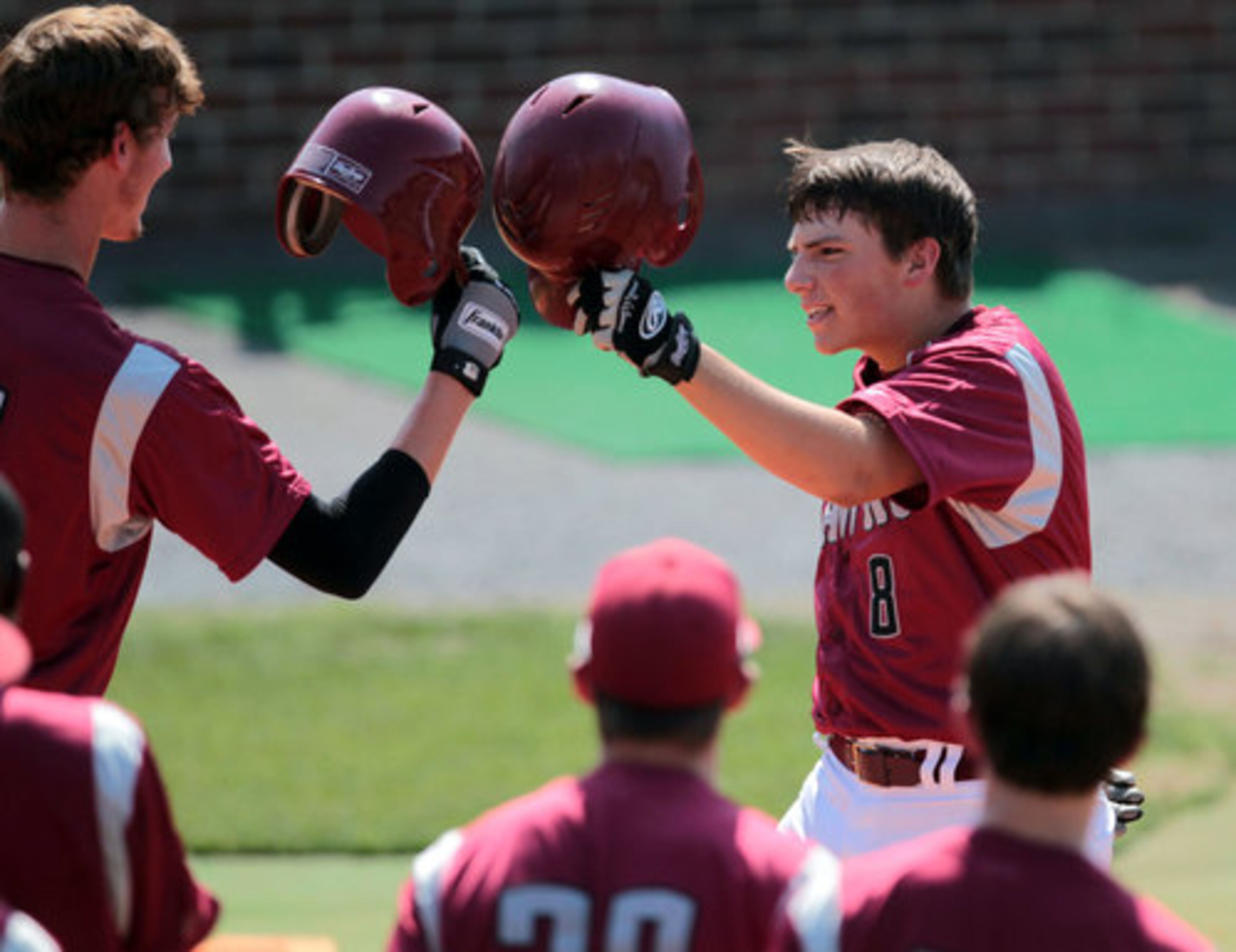 Hillgrove's Tucker Ehmig, right, celebrates with a teammate after hitting a solo home run.
