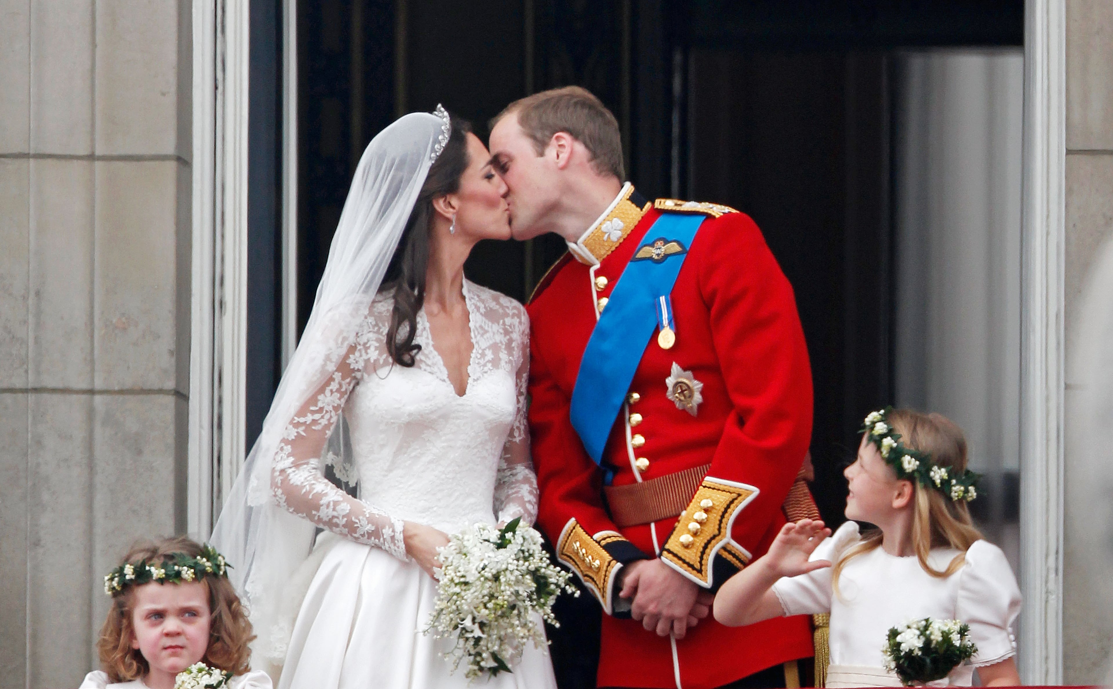 The world watched as Prince William kissed the Duchess of Cambridge on the balcony of Buckingham Palace in 2011. (Photo by Christopher Furlong/Getty Images)