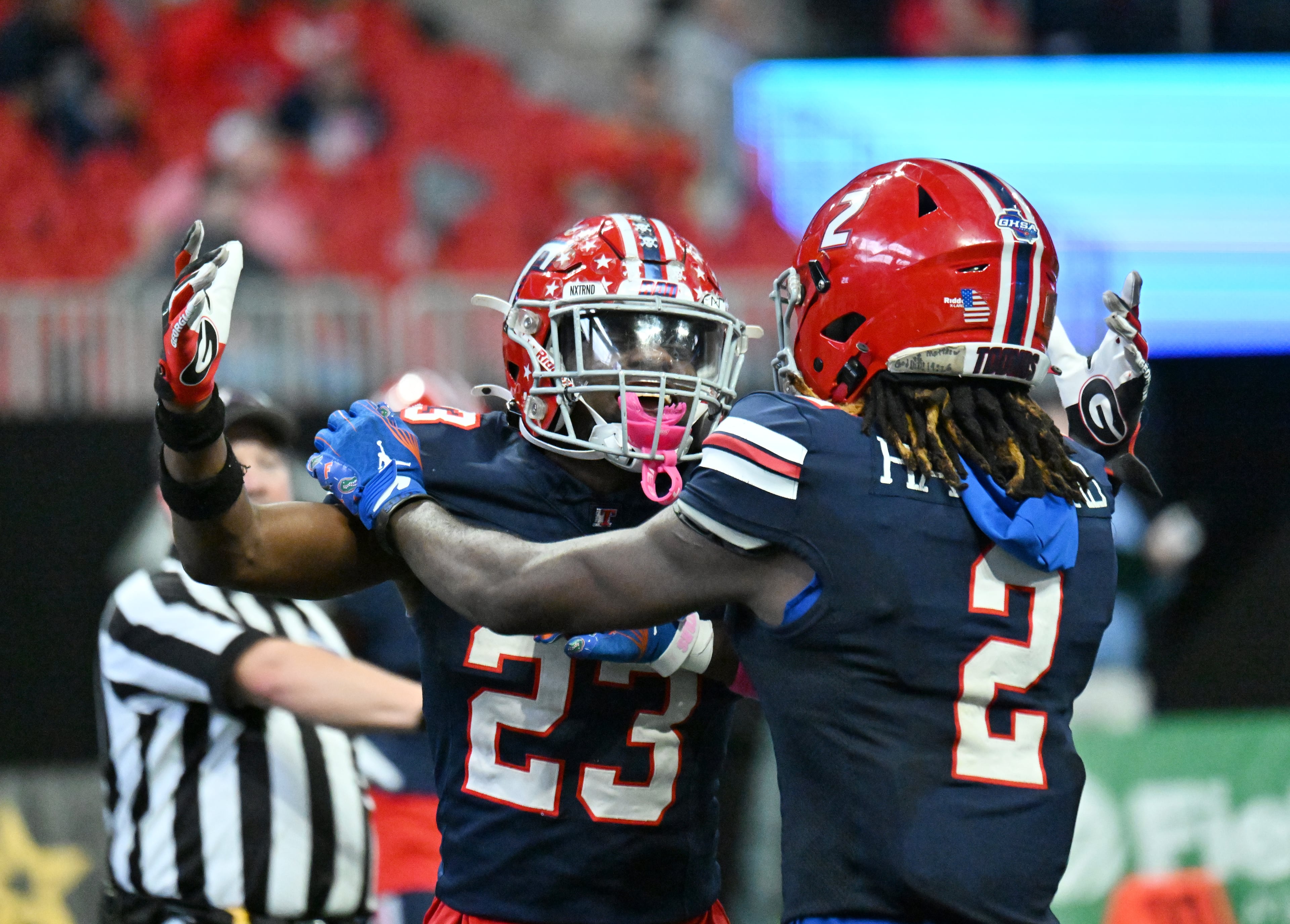 Toombs County's strong safety Alex Scott (23) and Toombs County's wide receiver Lagonza Hayward (2) react during the first half in GHSA Class A-Division State Championship game at Mercedes-Benz Stadium, Tuesday, December 17, 2024, in Atlanta. (Hyosub Shin / AJC)