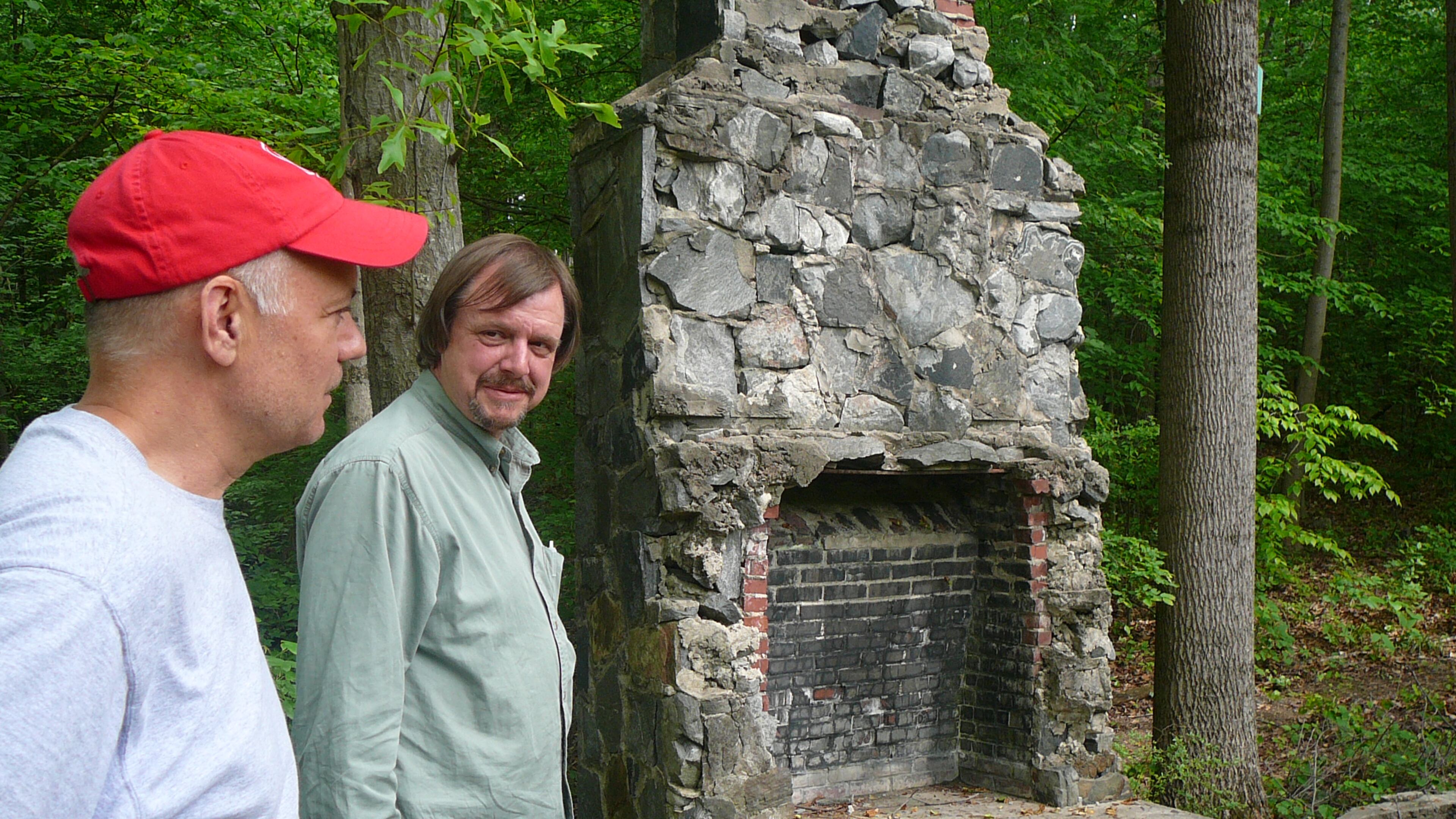 Don Penovi (left) and Keith Sharp explore the ruins of an old Boy Scout cabin in Spink-Collins Park, part of the Riverside neighborhood in northwest Atlanta.