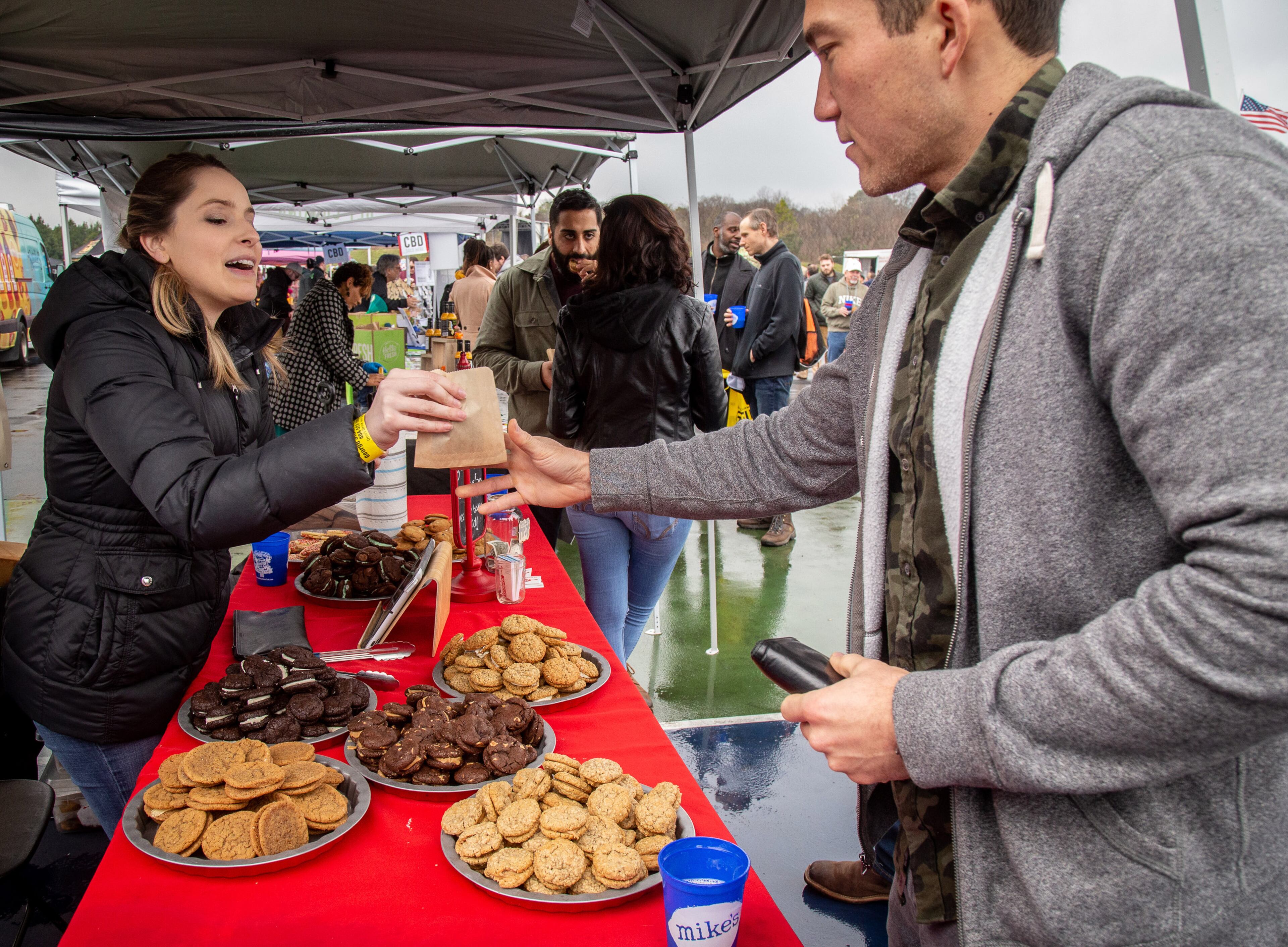 Erin Breaker sells cookies from Jimella's bakery during the Atlanta Winter Beer Festival at Atlantic Station on Saturday, February 1, 2020. STEVE SCHAEFER / SPECIAL TO THE AJC