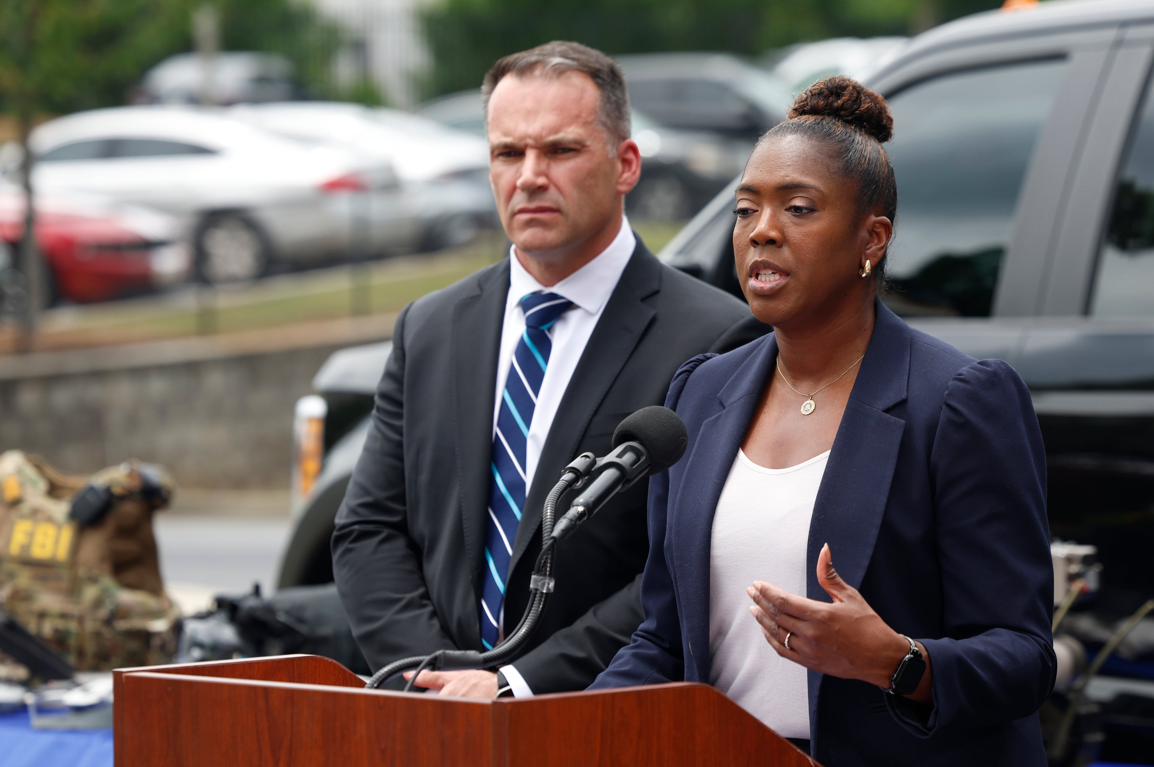 FBI Atlanta Special Agent in Charge Marlo Graham, right, and FBI Atlanta Assistant Special Agent in Charge Shawn Matthews, left, address the media at a press conference Thursday about the FBI’s safety plans for the 2026 FIFA World Cup in Atlanta. They displayed drones and other security gear and technology they might use during the six-week event. (Akili-Casundria Ramsess for the AJC)