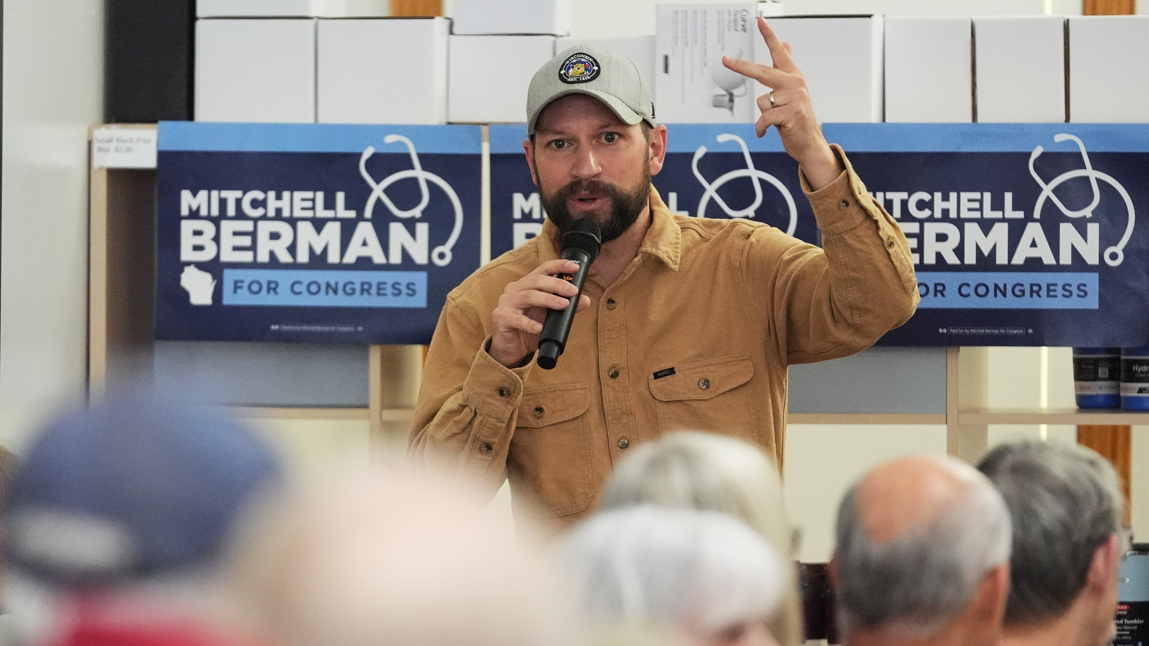 Democratic congressional candidate Mitchell Berman talks to supporters at Wilson's Coffee and Tea in Racine, Wis., Tuesday, Sept. 22, 2026.(AP Photo/Nam Y. Huh)