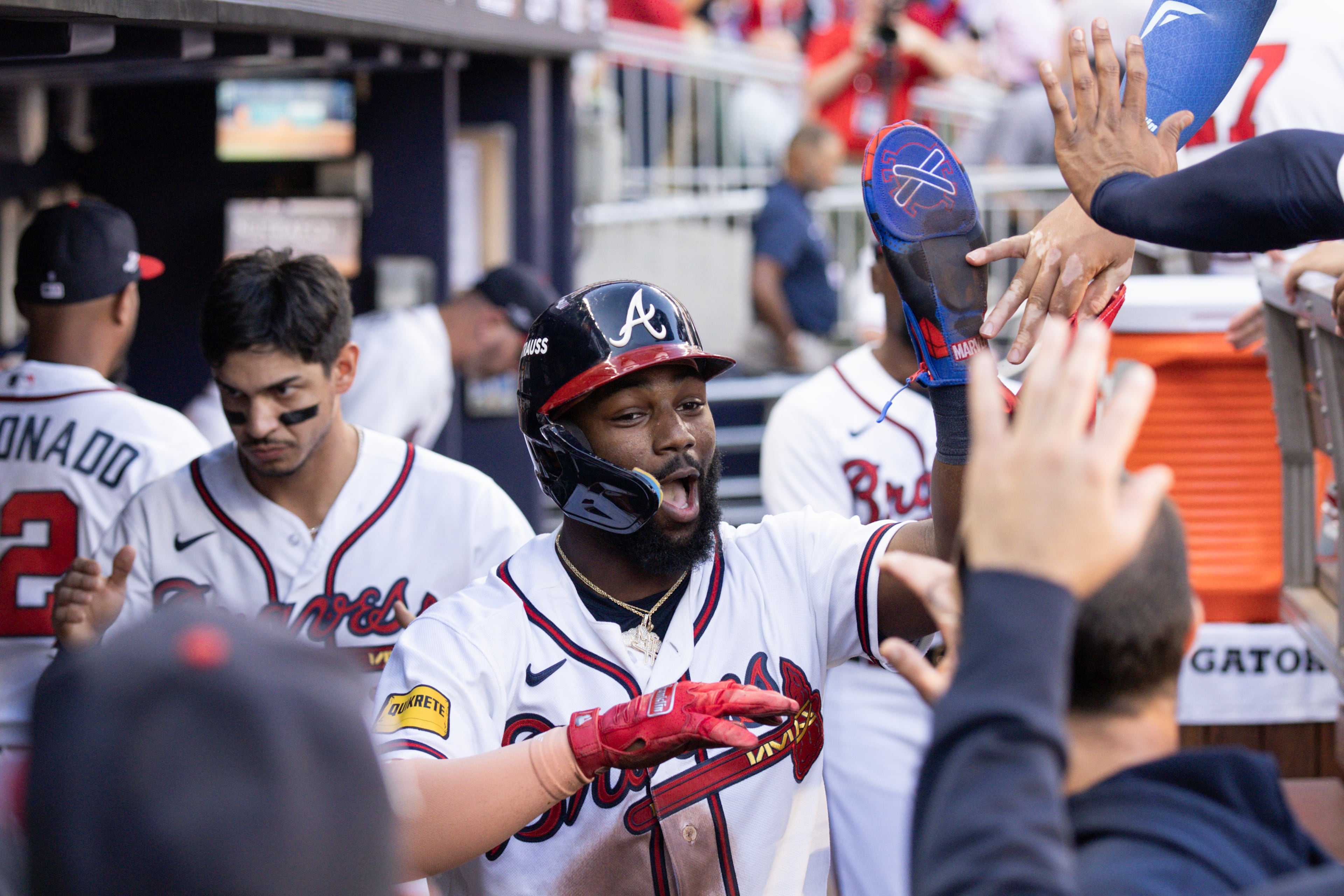 Atlanta Braves' Michael Harris II celebrates in the dugout after scoring against the Los Angeles Dodgers during the first inning of Game 4 of the MLB National League Division Series between the Atlanta Braves and the Los Angeles Dodgers, Wednesday, Oct. 7, 2026, in Atlanta. (Miguel Martinez/AJC)