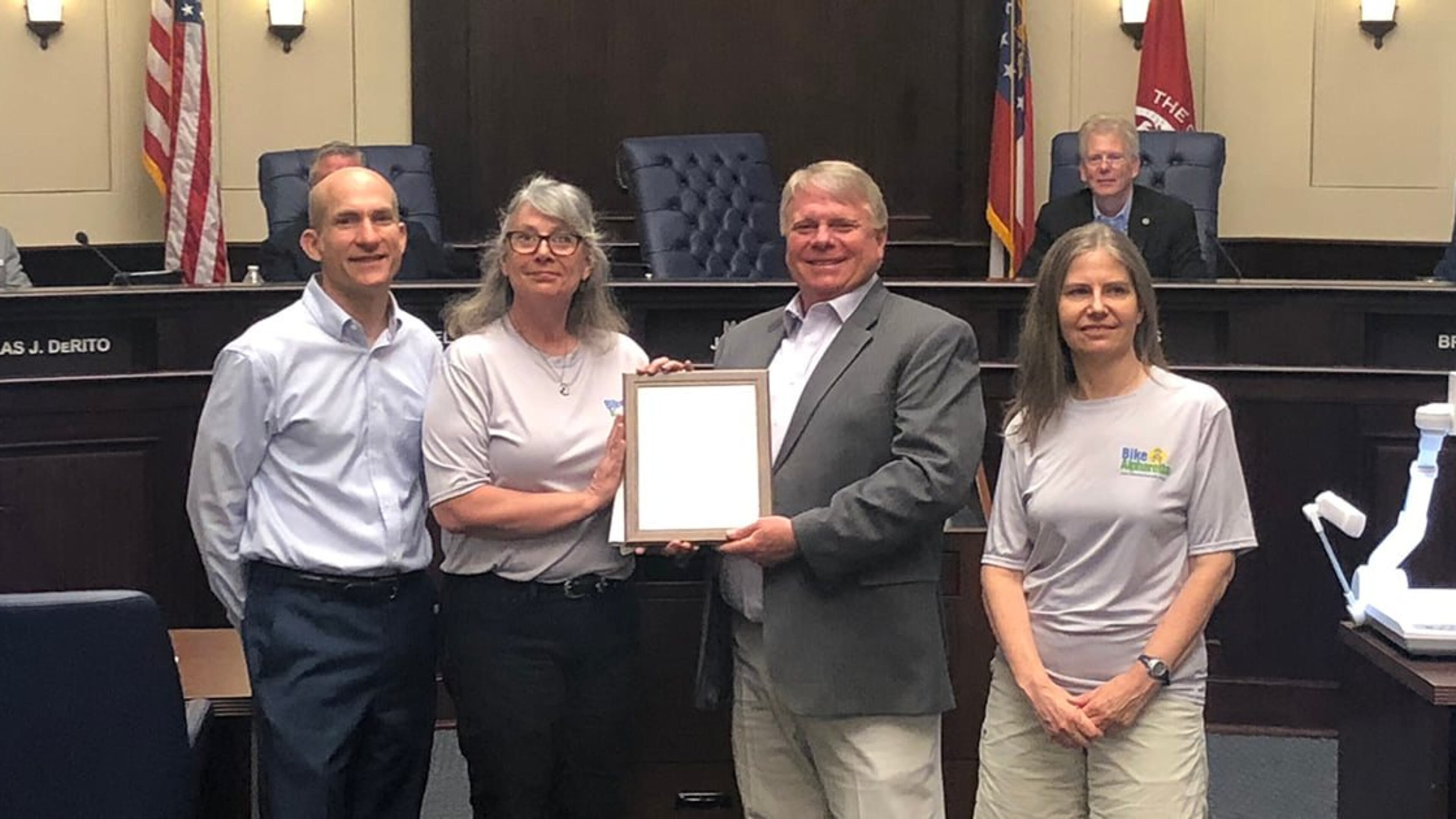 Representatives from Bike Alpharetta join Alpharetta officials on May 2 to declare May as Bike Month in the city. (Courtesy City of Alpharetta)