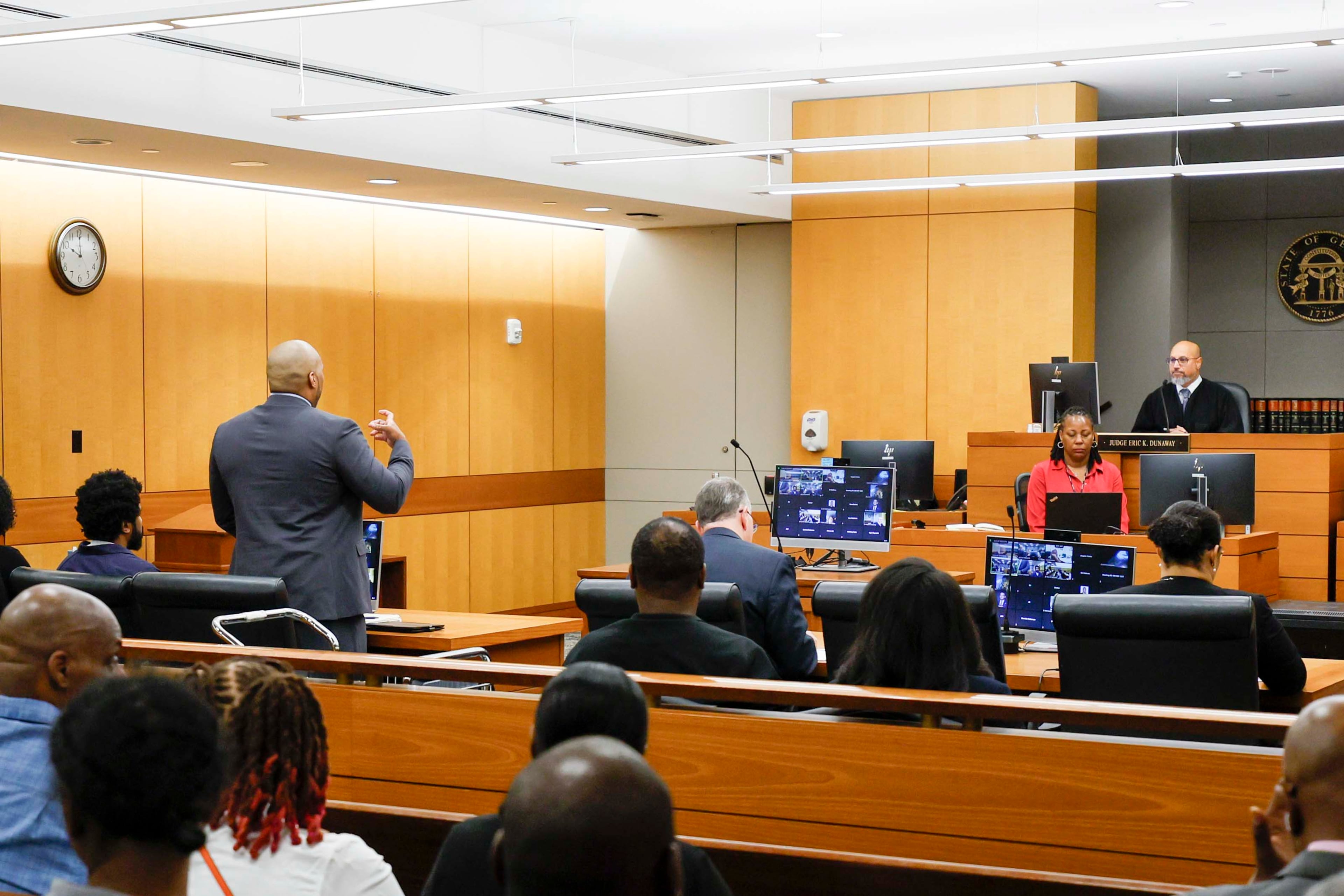 Public defender Shawn Hoover, representing Deion Duwane Patterson, speaks to Judge Eric Dunaway during a hearing at Fulton County Superior Court on Thursday, April 16. (Miguel Martinez/AJC)