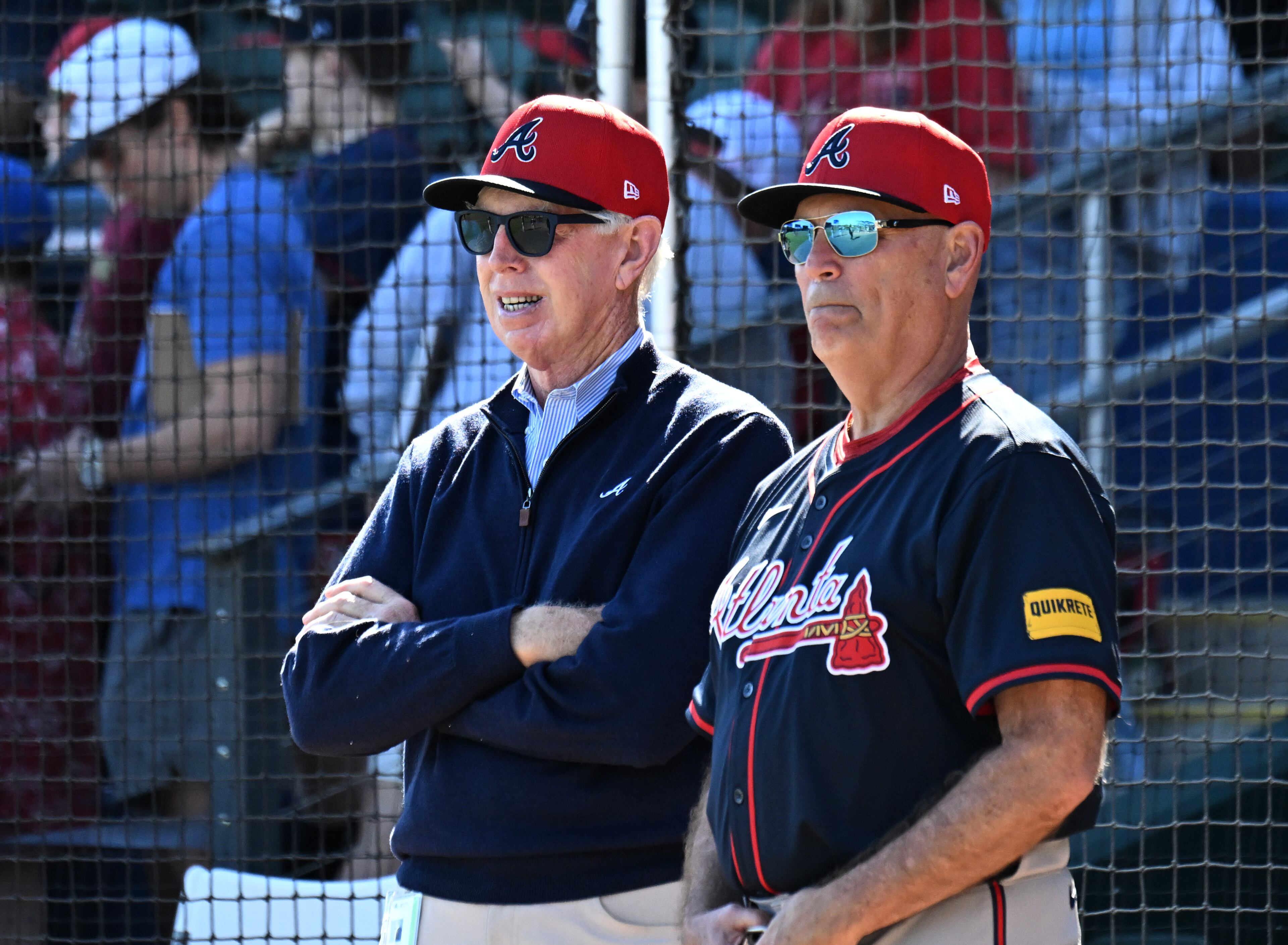 Terry McGuirk (left), Chairman & CEO of Atlanta Braves, and manager Brian Snitker watch batting practice during spring training workouts at CoolToday Park, Monday, February 17, 2025, North Port, Florida. (Hyosub Shin / AJC)