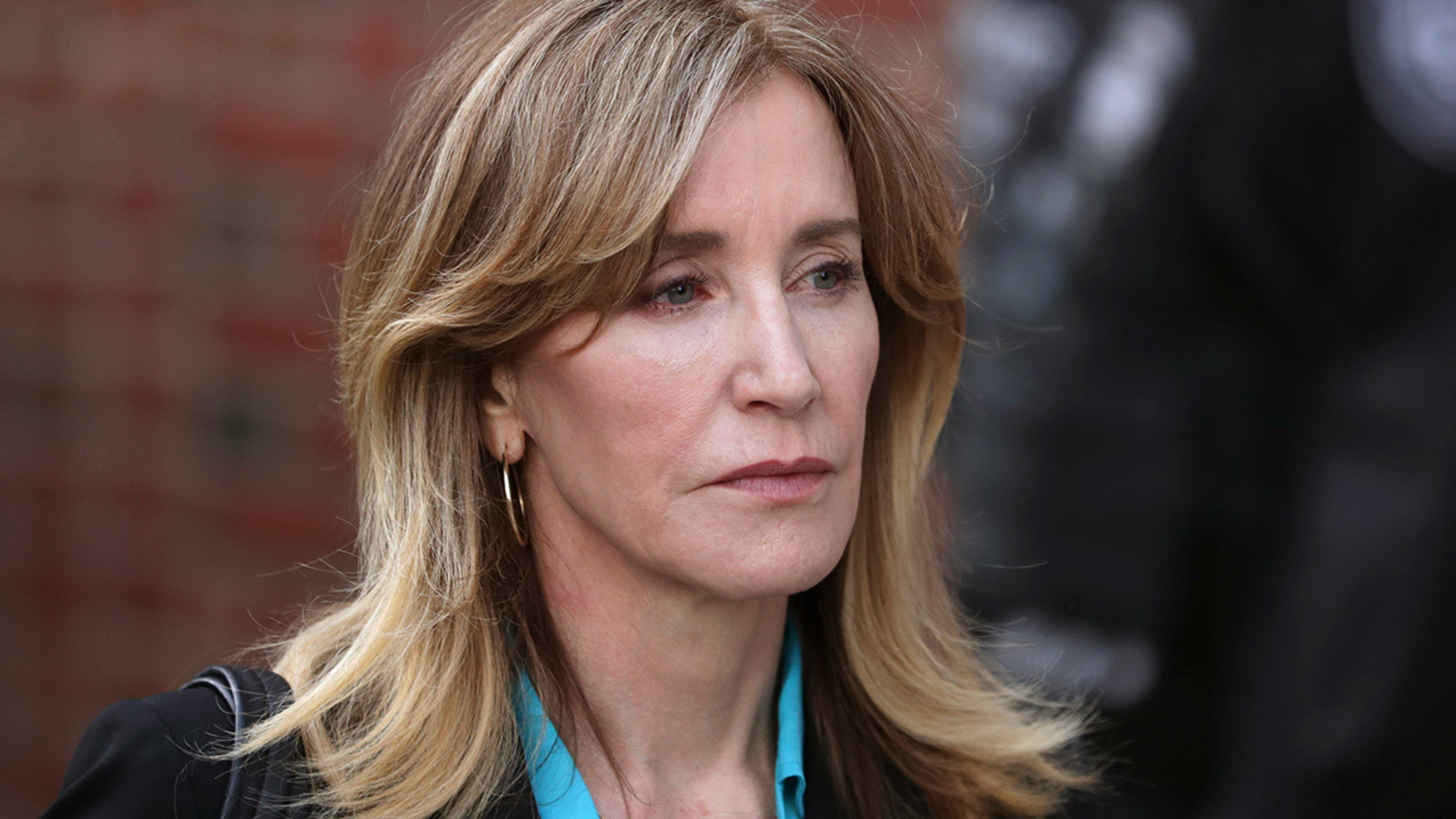 Actress Felicity Huffman departs federal court in Boston on Wednesday, April 3, 2019, after facing charges in a nationwide college admissions bribery scandal. (AP Photos/Charles Krupa)