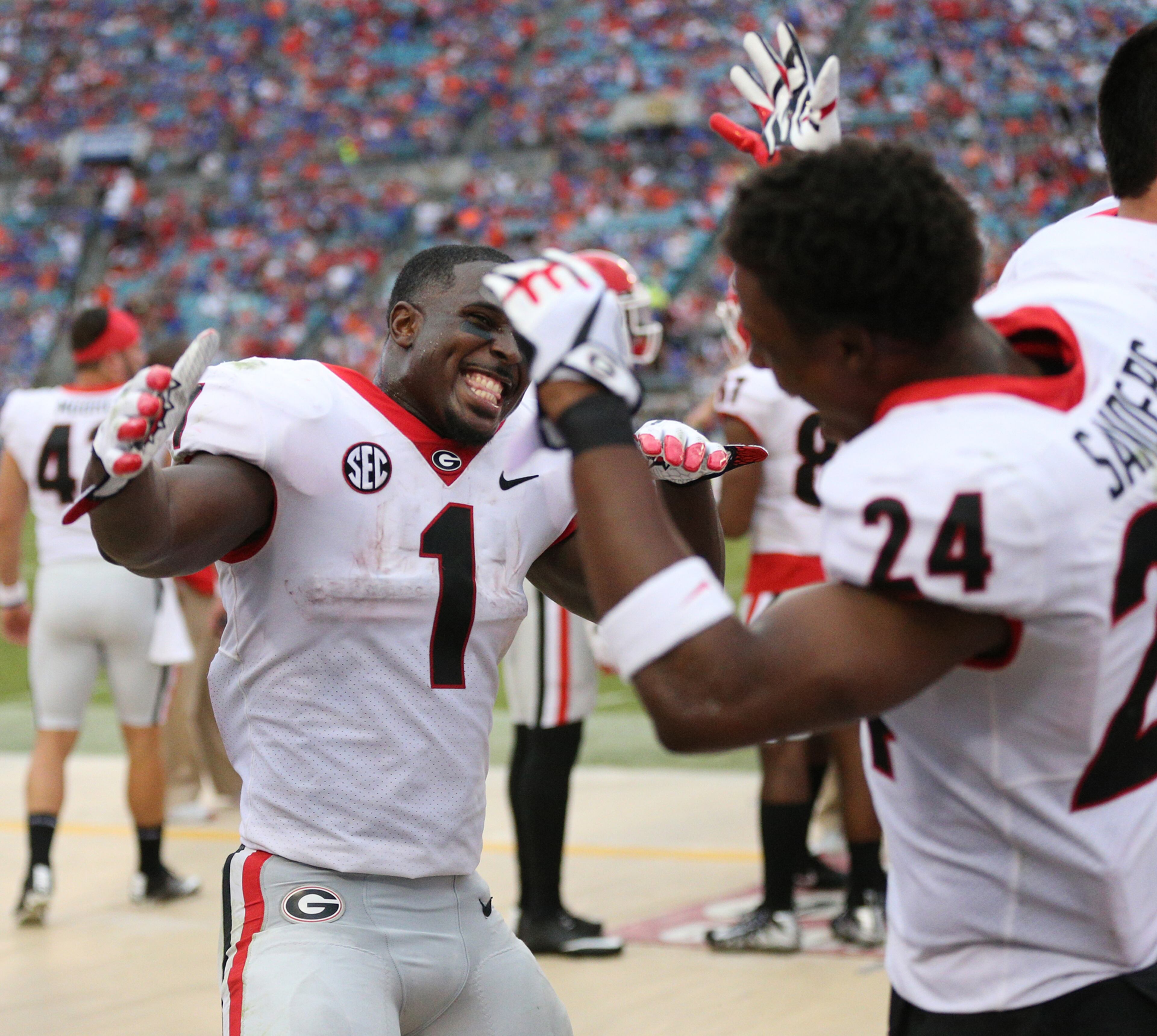 October 28, 2017 Jacksonville: Georgia tailback Sony Michel, who had two touchdowns, celebrates with Dominick Sanders during a 42-7 victory over Florida in a NCAA college football game on Friday, October 27, 2017, in Jacksonville. Georgia beat Florida 42-7. Curtis Compton/ccompton@ajc.com