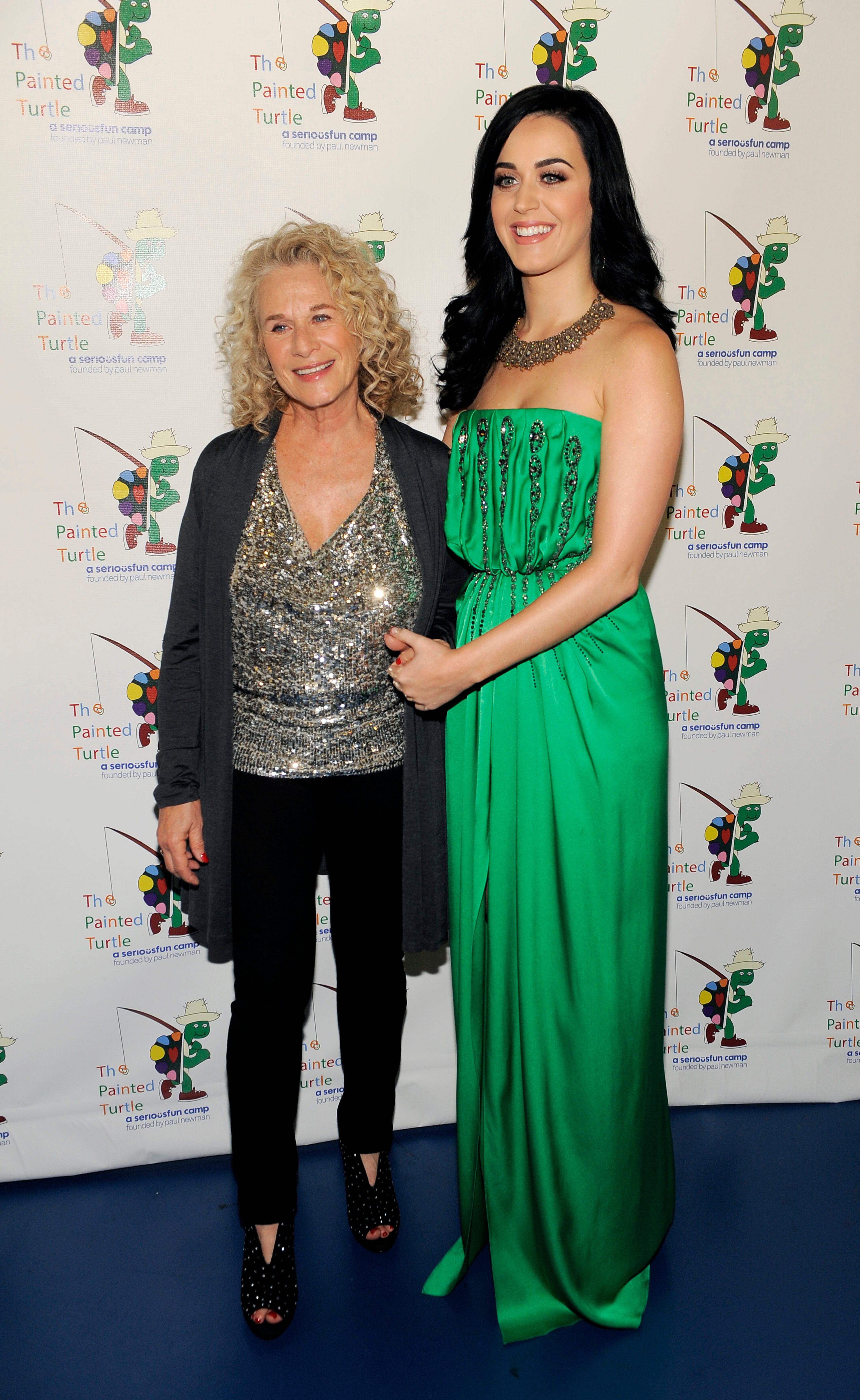 Singer-songwriter Carole King, left, poses with guest performer Katy Perry at A Celebration of Carole King and her Music at The Dolby Theatre on Tuesday, Dec. 4, 2012, in Los Angeles. (Photo by Chris Pizzello/Invision/AP)