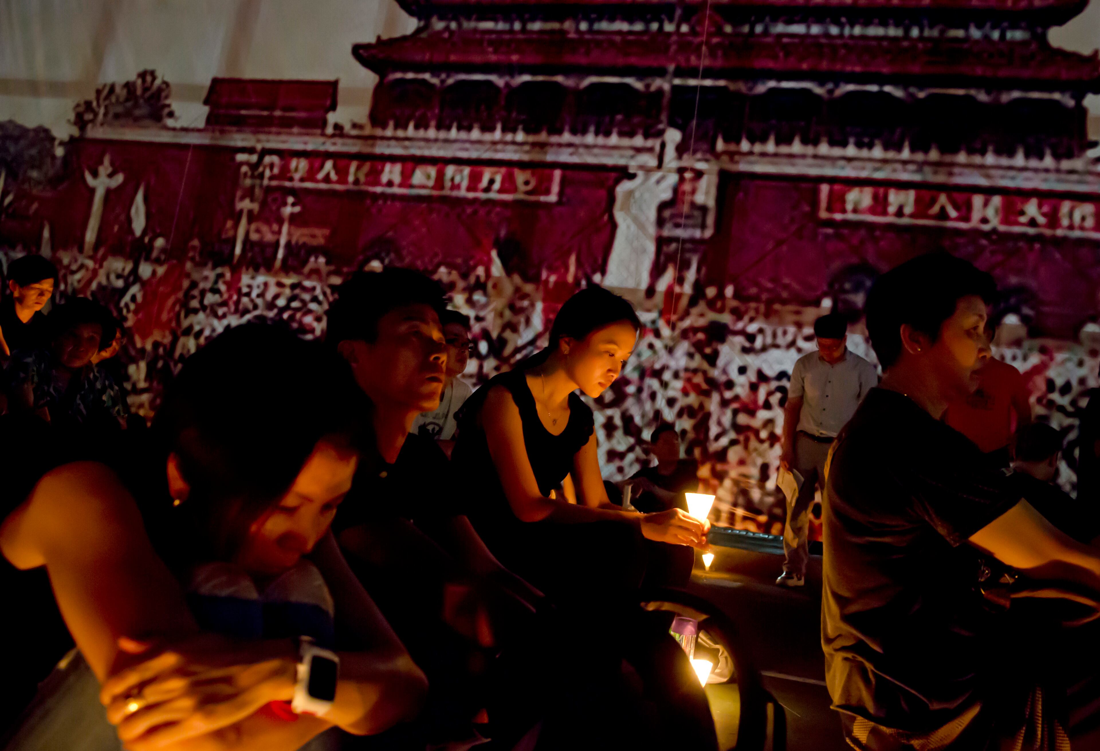 Some of the thousands of people attend a candlelight vigil at Victoria Park in Hong Kong, Thursday, June 4, 2015. Hong Kongers held a candlelight vigil Thursday night to mark the suppression of the 1989 student-led Tiananmen Square protests, an annual event that takes on greater meaning for the city's young after last autumn's pro-democracy demonstrations sharpened their sense of unease with Beijing. (AP Photo / Kin Cheung)
