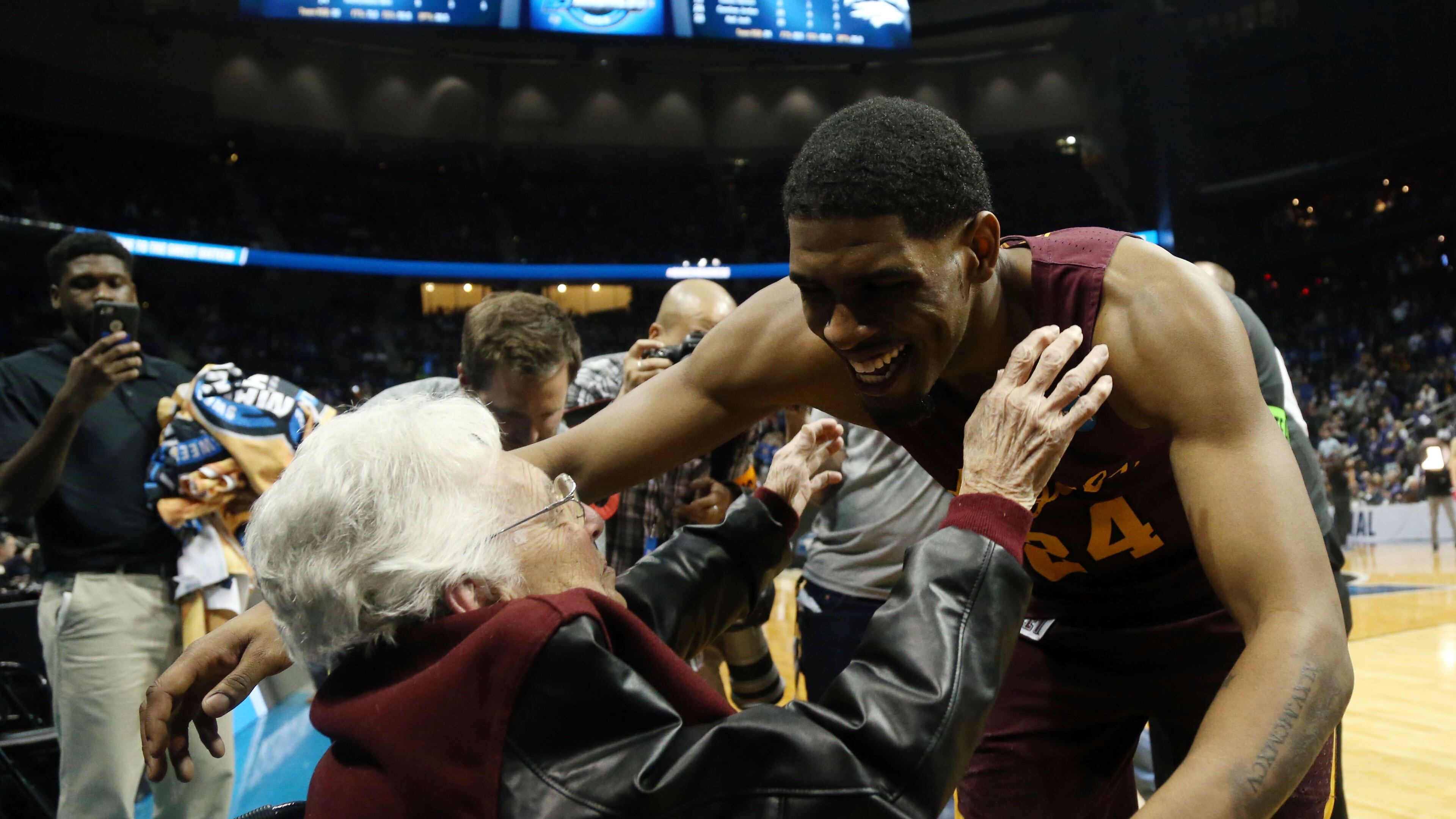 Mar 22, 2018; Atlanta, GA, USA; Loyola Ramblers forward Aundre Jackson (24) hugs Sister Jean Dolores-Schmidt after defeating the Nevada Wolf Pack in the semifinals of the South regional of the 2018 NCAA Tournament at Philips Arena. Mandatory Credit: Brett Davis-USA TODAY Sports ORG XMIT: USATSI-378335 ORIG FILE ID: 20180322_ajw_ad1_142.jpg
